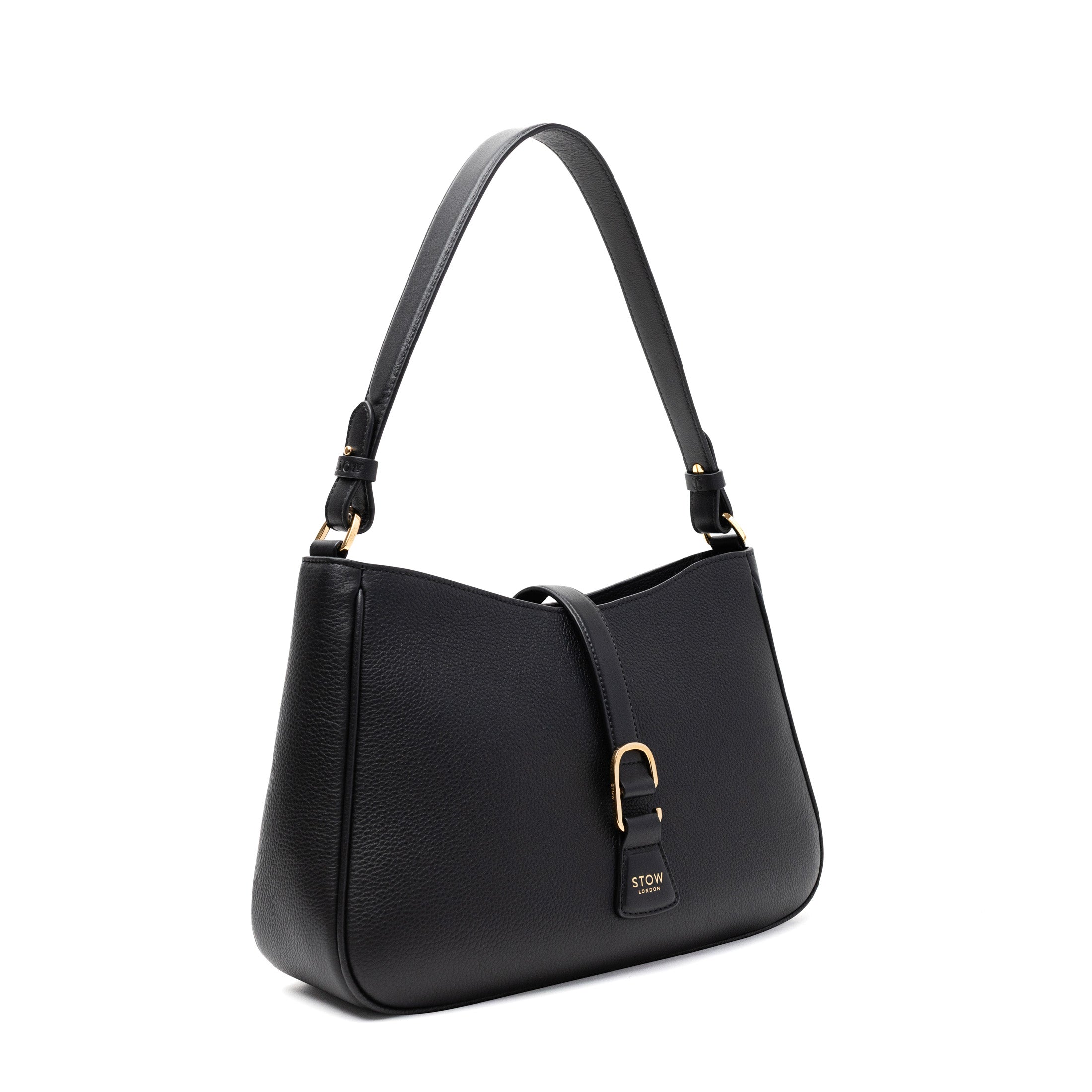 Off-axis view of STOW London's Beth bag in Black pebbled and smooth leather featuring gold-coated stainless steel hardware and clip on a white background