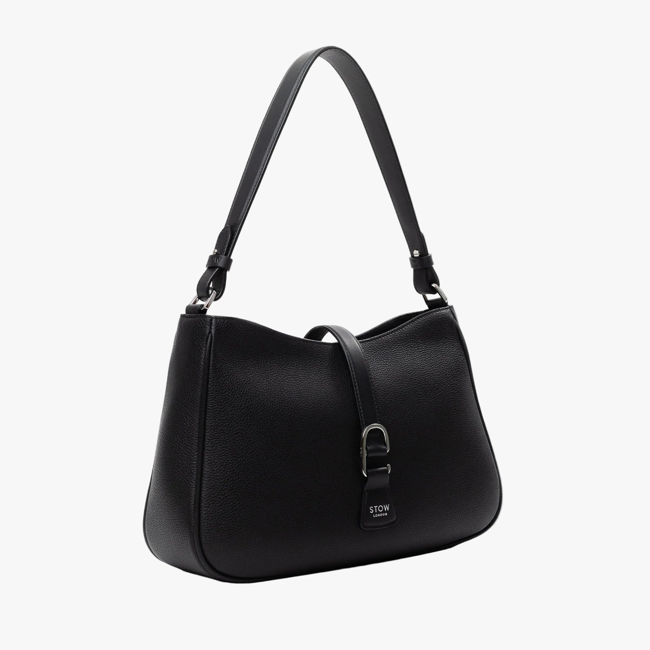 Off-axis view of STOW London's Beth bag in Black pebbled and smooth leather featuring silver stainless steel hardware and clip on a white background