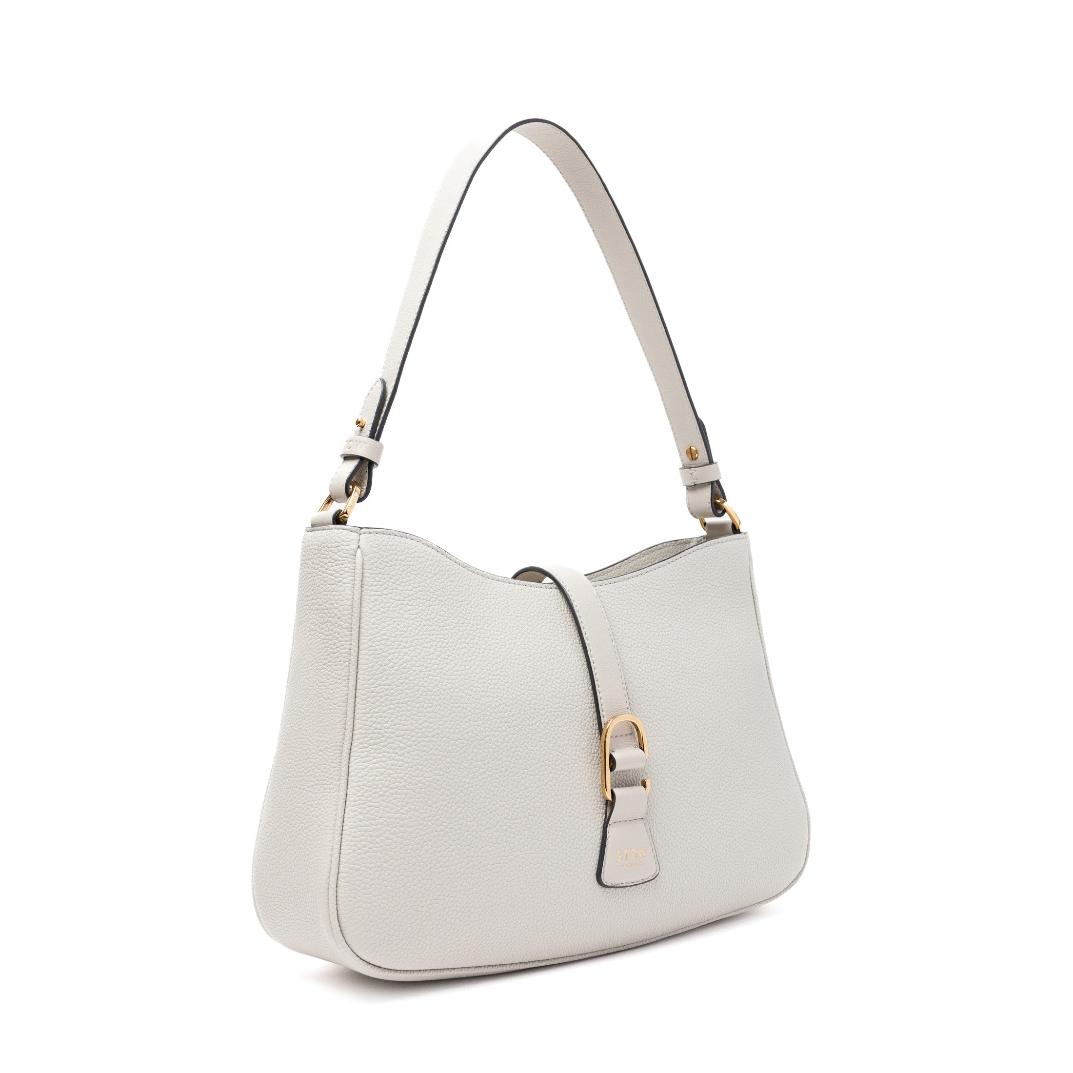 Off-axis view of STOW London's Beth bag in Cloud Grey pebbled and smooth leather featuring gold-coated stainless steel hardware and clip on a white background