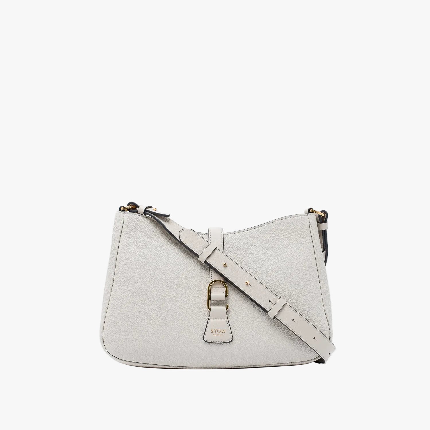 STOW London's Beth bag and detachable crossbody strap in Cloud Grey leather featuring gold stainless steel hardware on a white background