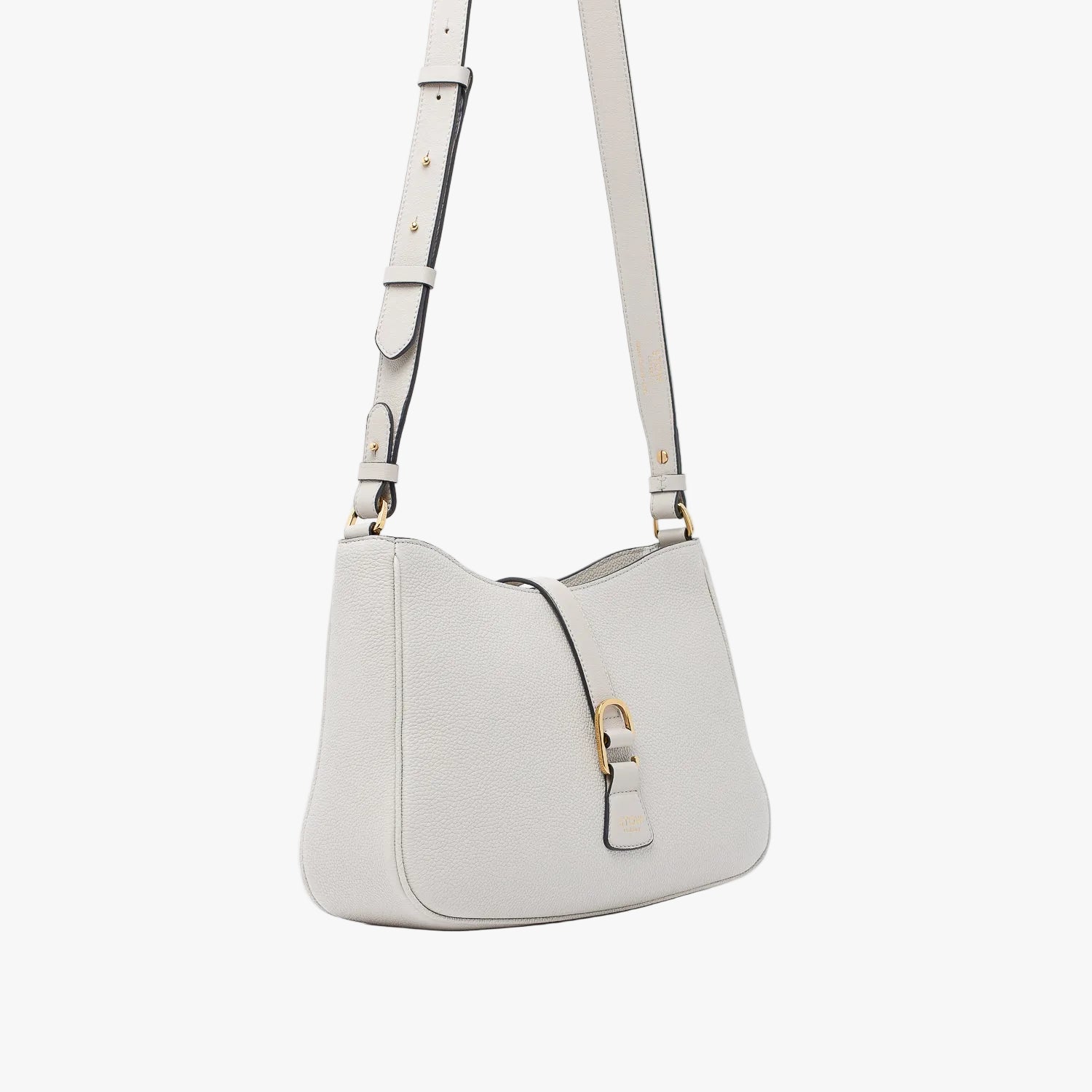 Off-axis view of STOW London's Beth bag and detachable crossbody strap in Cloud Grey leather featuring gold stainless steel hardware on a white background