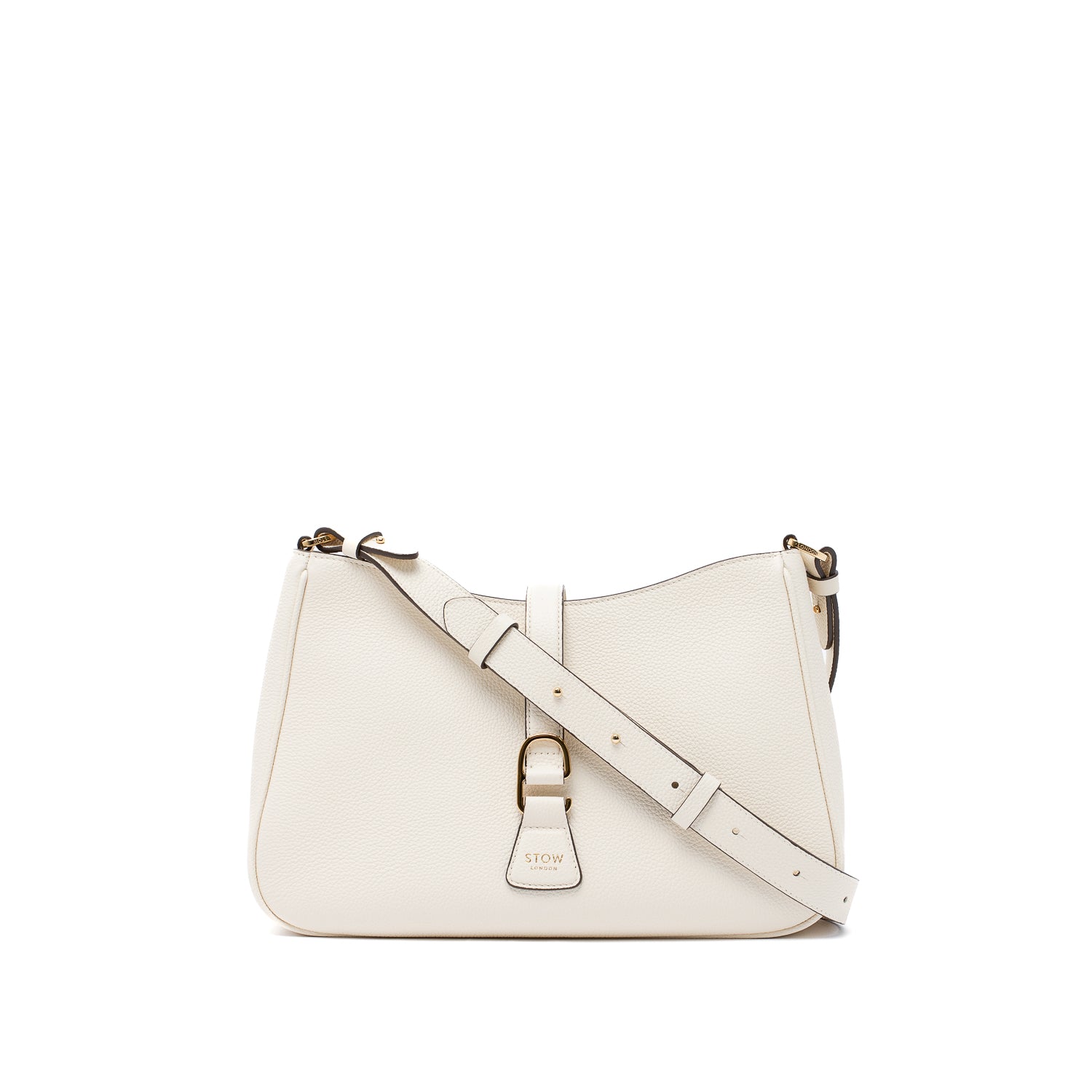 STOW London's Beth bag and detachable crossbody strap in Spring Moon leather featuring gold stainless steel hardware on a white background