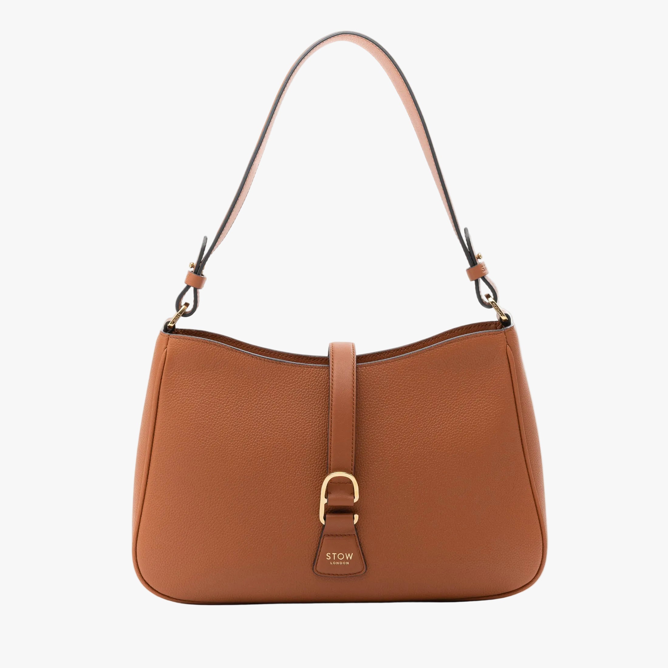 STOW London's Beth bag in Earth Tan pebbled and smooth leather featuring gold-coated stainless steel hardware and clip on a white background