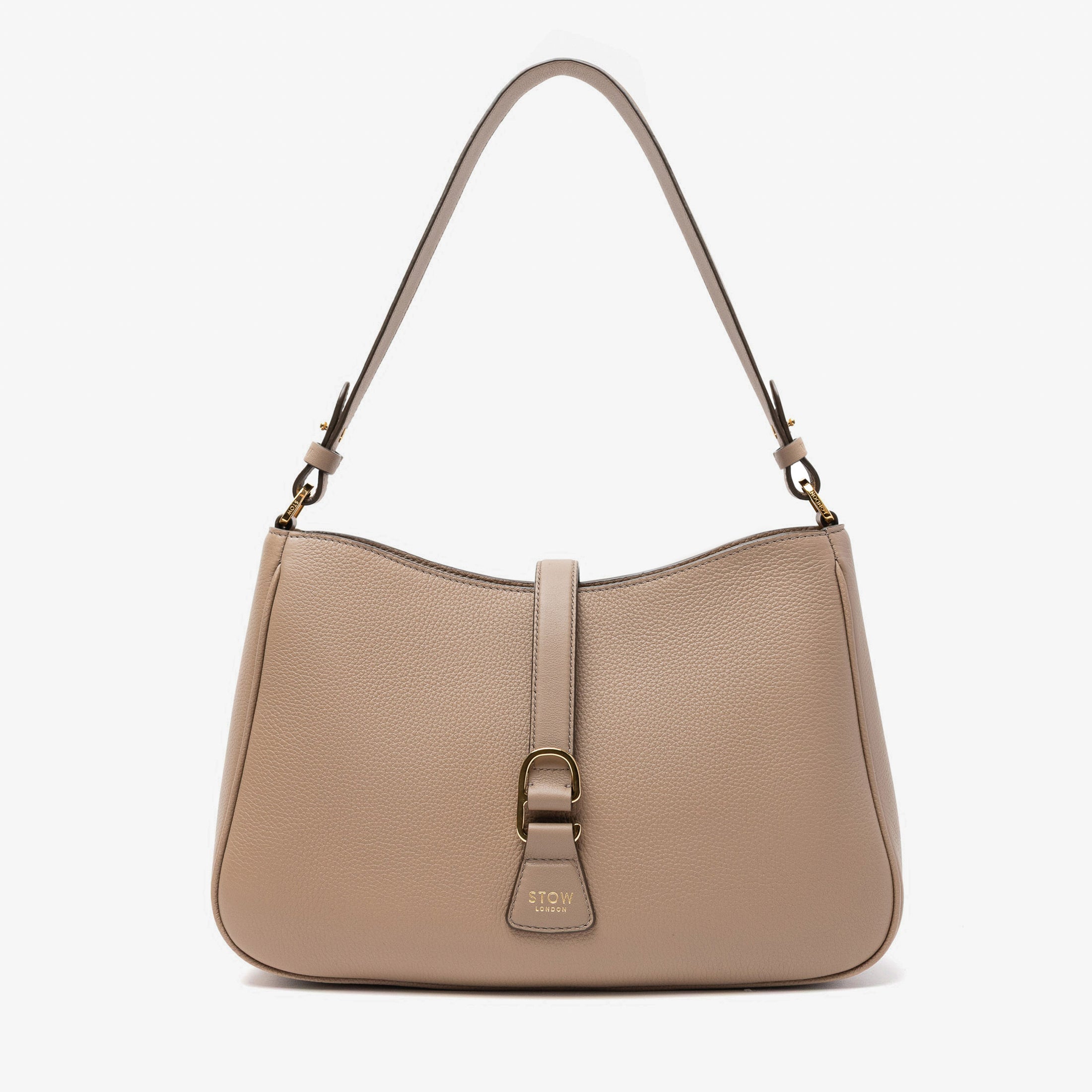 STOW London's Beth bag in Warm Taupe pebbled and smooth leather featuring gold-coated stainless steel hardware and clip on a white background