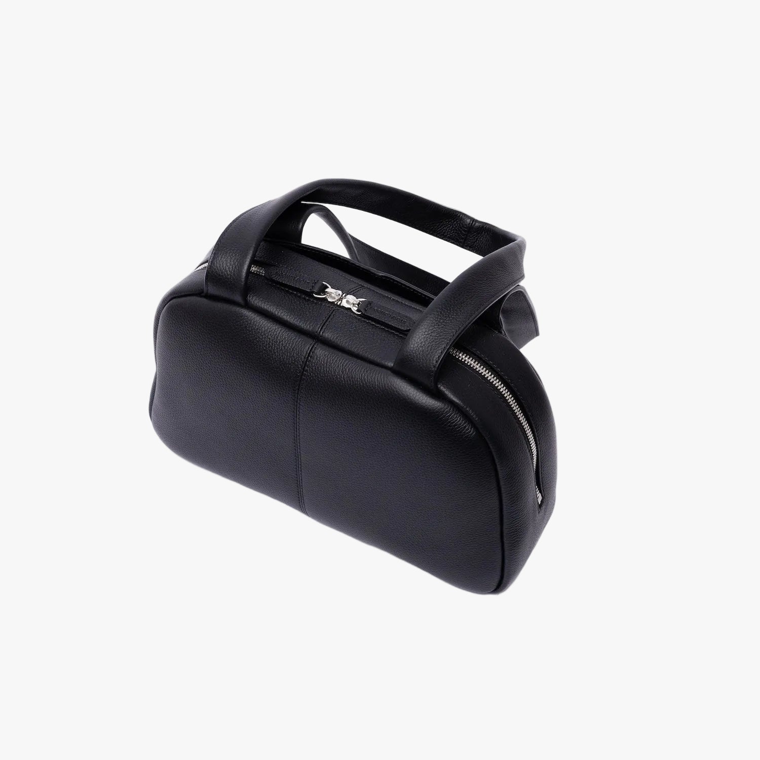 Top view of STOW London's Bowling bag in Black pebbled leather featuring silver stainless steel hardware and zip closure on a light grey background