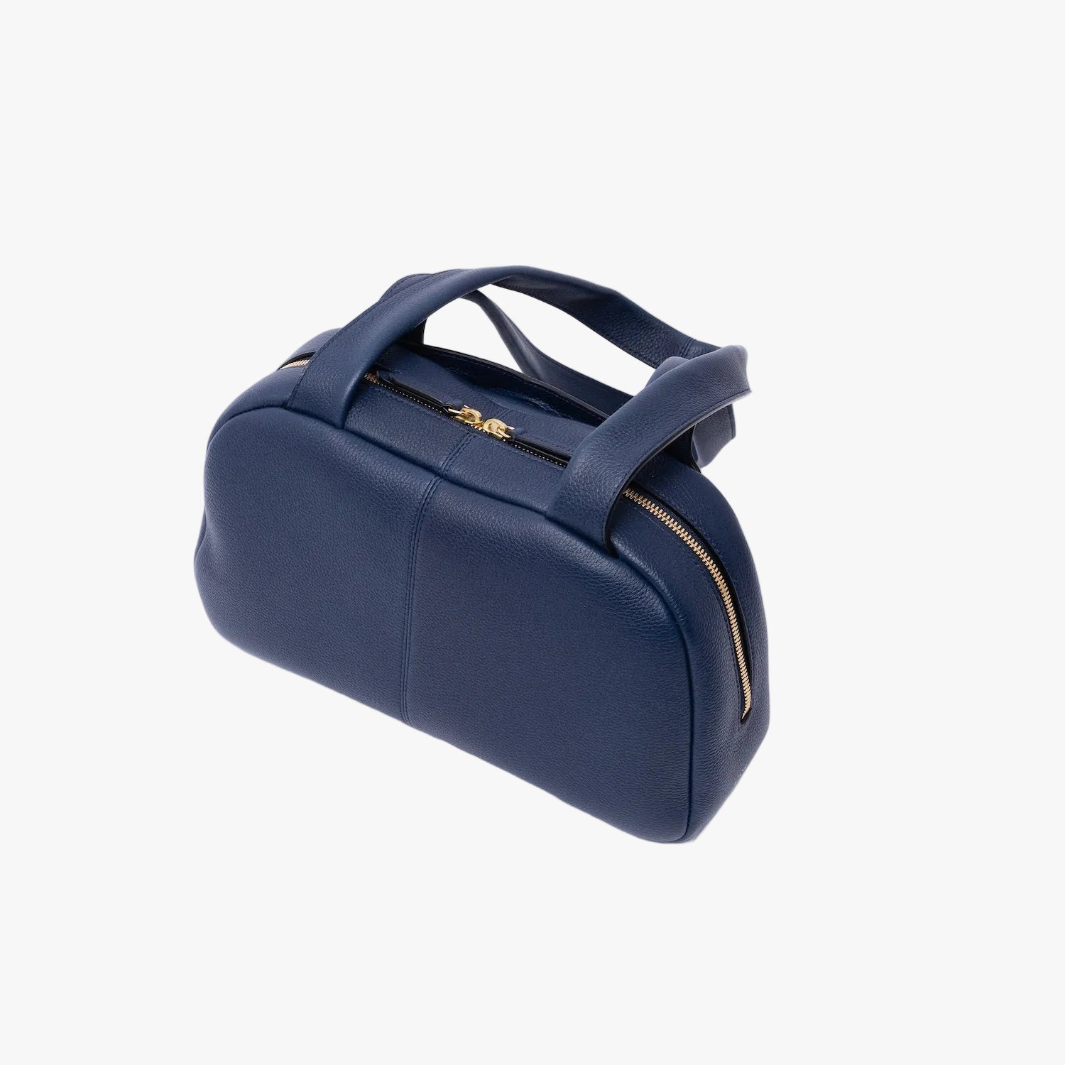 Top view of the back of STOW London's Bowling bag in Navy pebbled leather featuring gold-coated stainless steel hardware on a light grey background