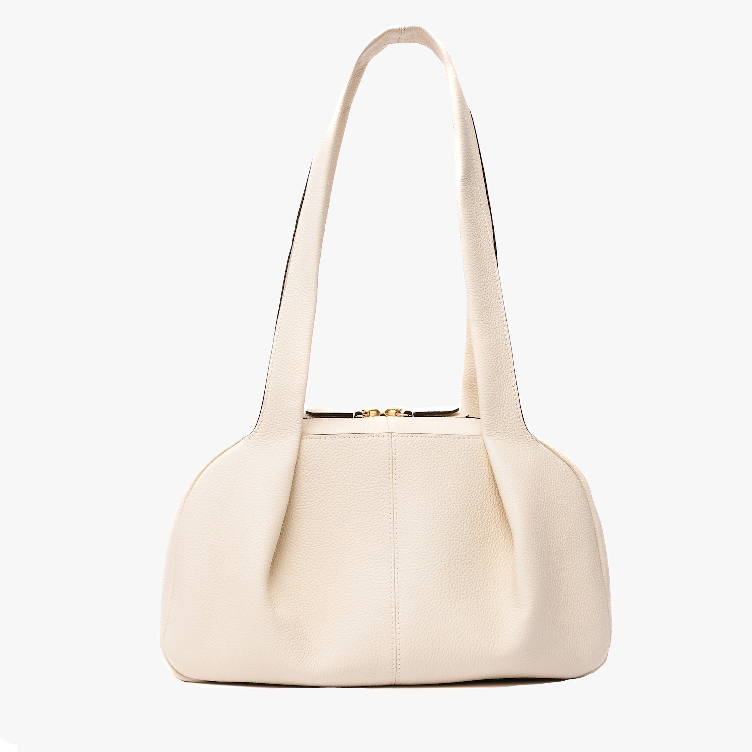 STOW London's Bowling bag in Spring Moon pebbled leather featuring the pleated front panel and gold-coated stainless steel hardware on a light grey background