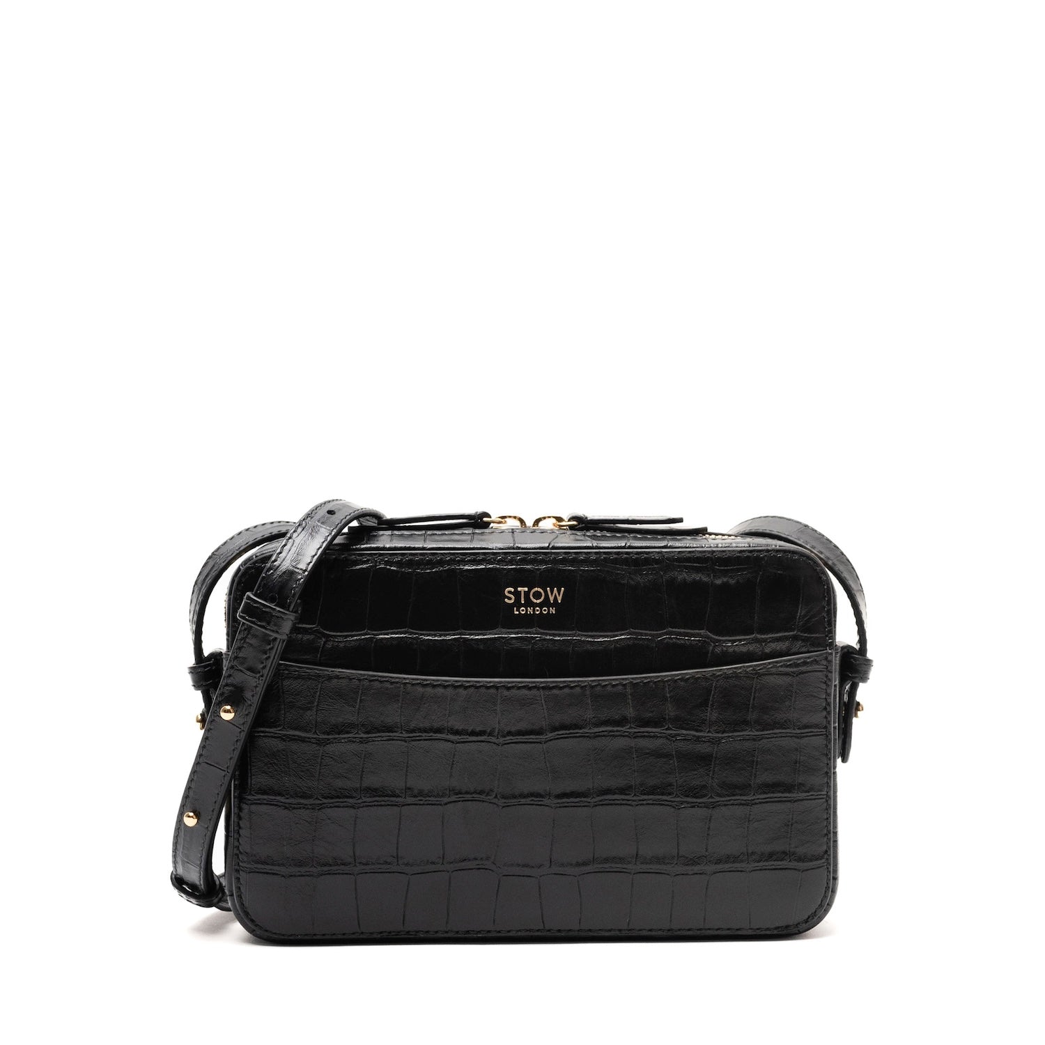 STOW London's Camera bag in Black Embossed Croc leather with detachable crossbody strap featuring gold-coated stainless steel hardware on a white background