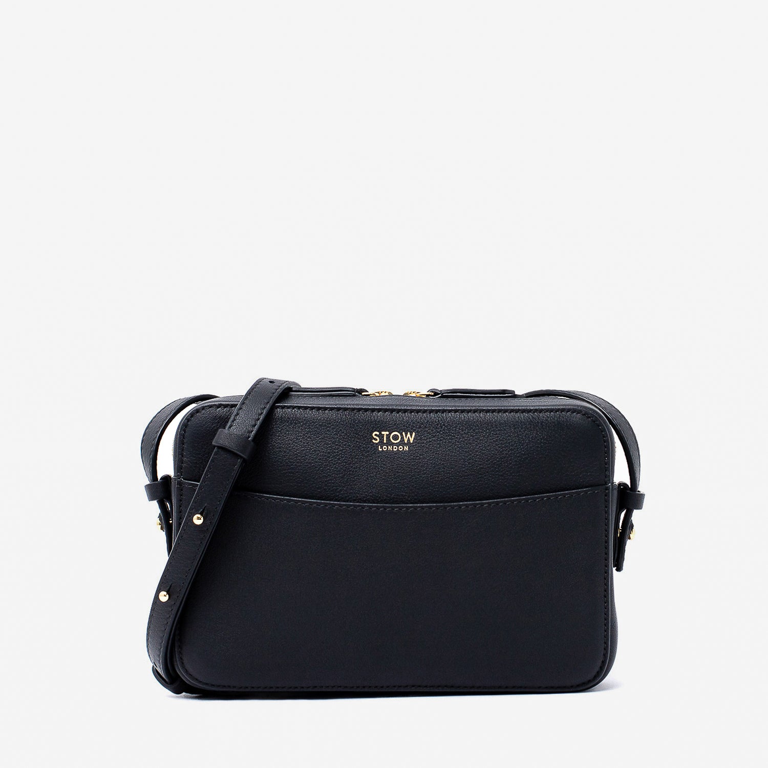 STOW London's Camera bag in Black smooth leather with detachable crossbody strap featuring gold-coated stainless steel hardware on a white background