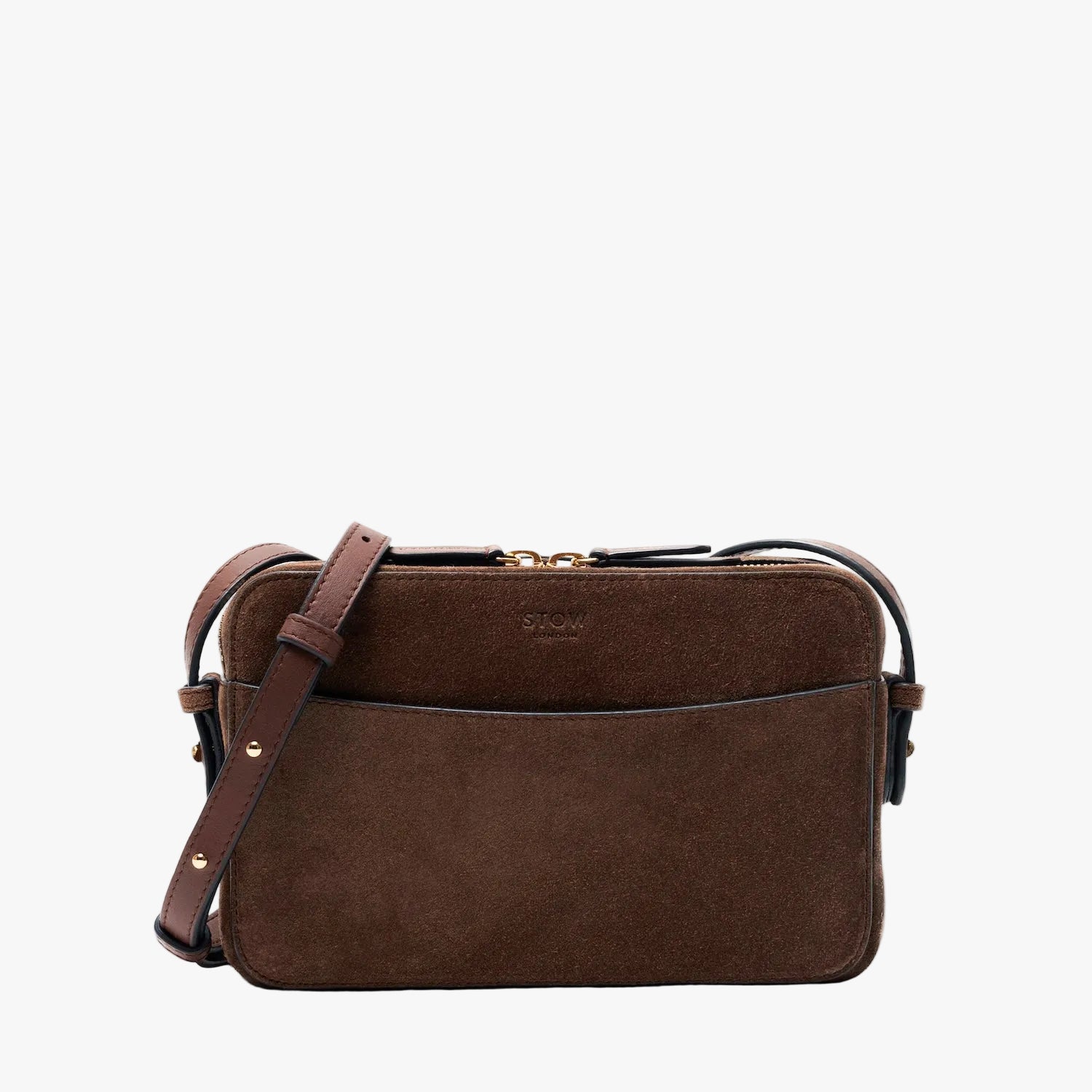 STOW London's Camera bag in Chocolate Suede leather with detachable crossbody strap featuring gold-coated stainless steel hardware on a light grey background