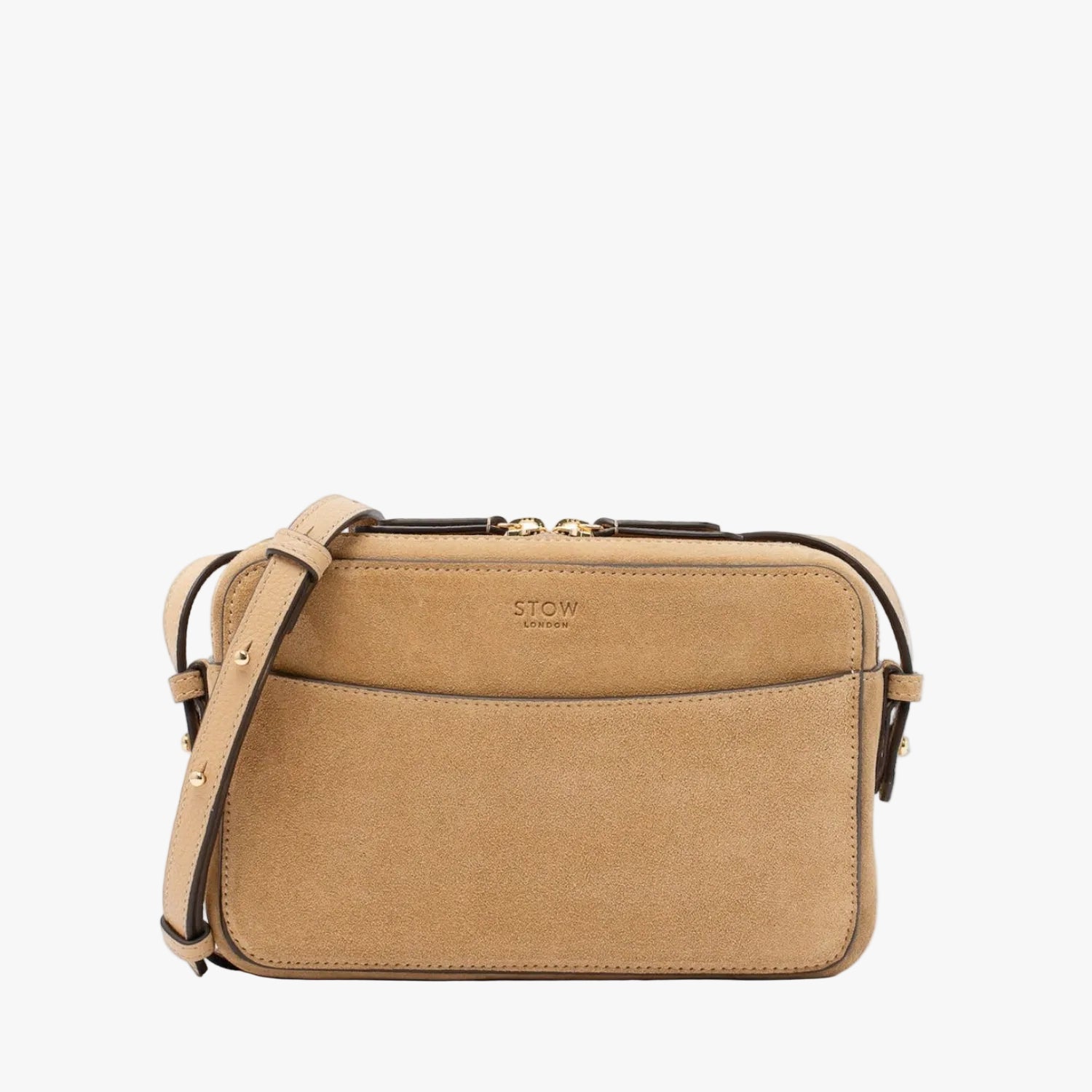 STOW London's Camera bag in Soft Sand Suede leather with detachable crossbody strap featuring gold-coated stainless steel hardware on a white background