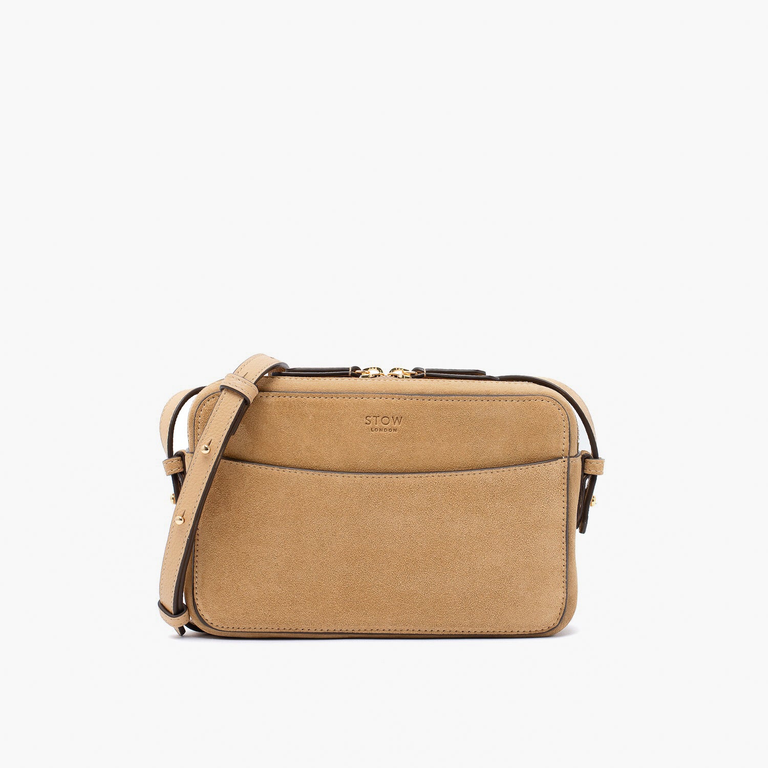STOW London's Camera bag in Soft Sand Suede leather with detachable crossbody strap featuring gold-coated stainless steel hardware on a white background