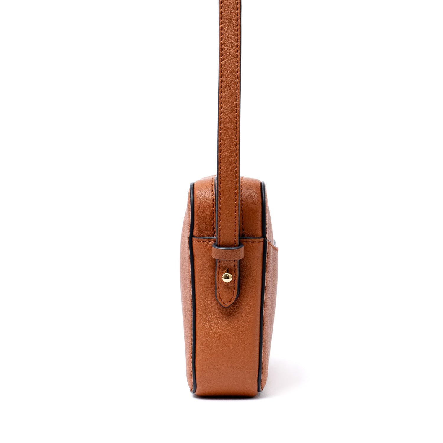 Side view of STOW London's Camera bag in Earth Tan smooth leather with detachable crossbody strap on a white background