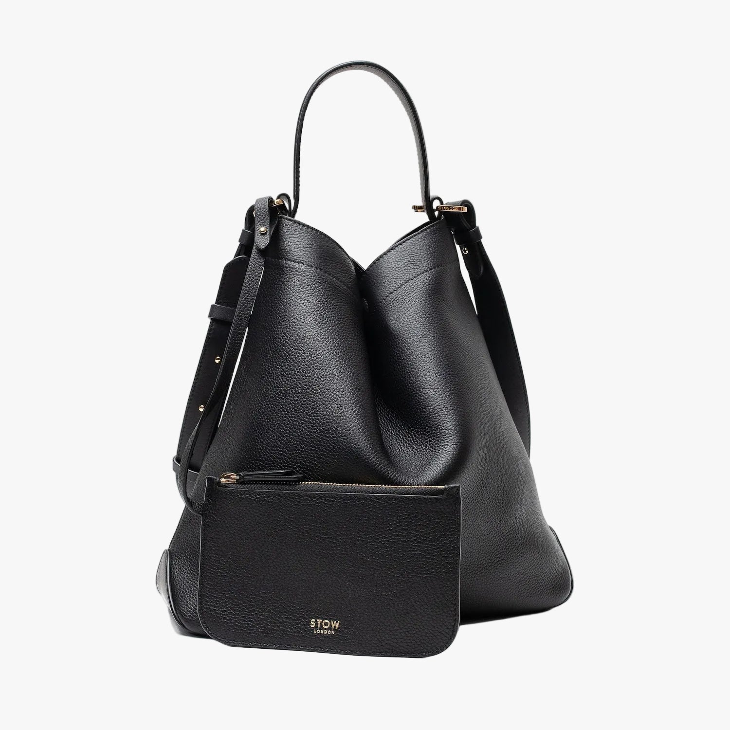 STOW London's Curve bag and matching, detachable interior pouch in Black leather featuring gold-coated stainless steel hardware on a light grey background