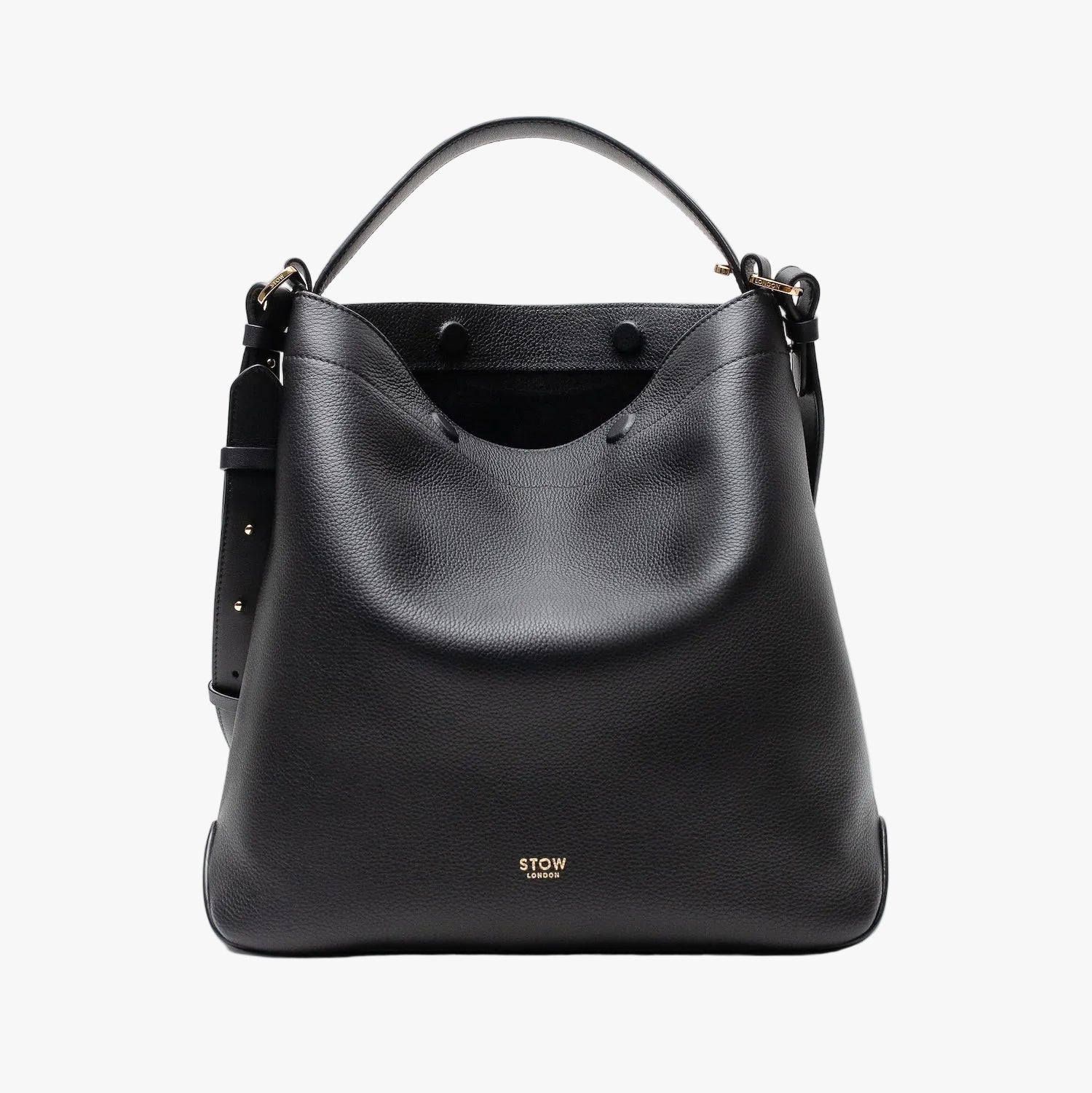 STOW London's Curve bag in Black pebbled leather with magnets open showing the black suede interior lining featuring gold-coated stainless steel hardware on a light grey background