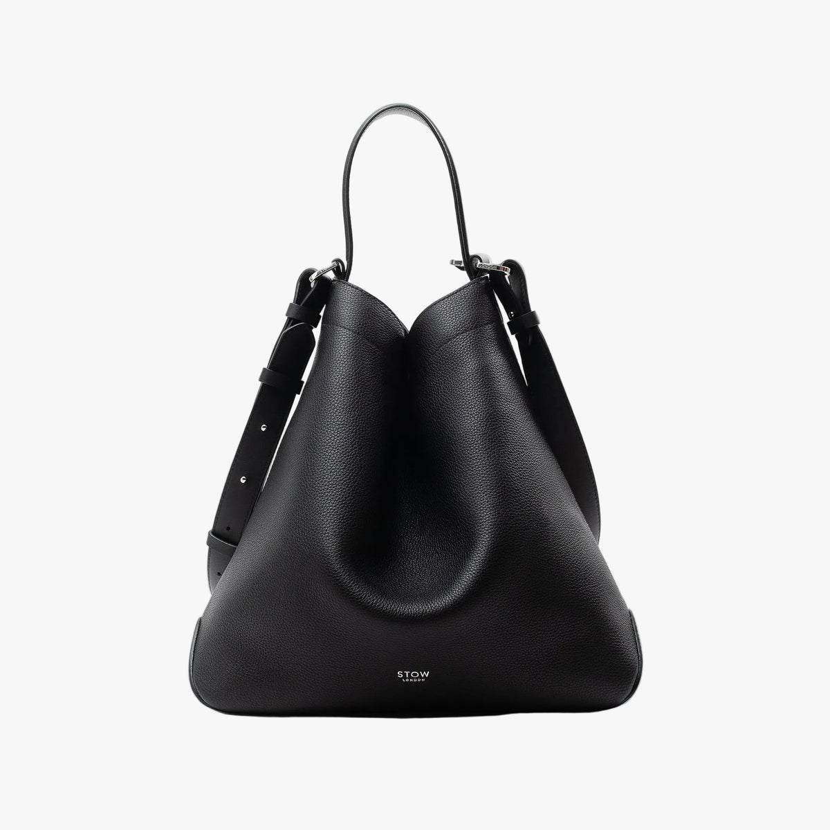 STOW London's Curve bag in Black pebbled leather shaped in a triangular featuring silver stainless steel hardware on a light grey background