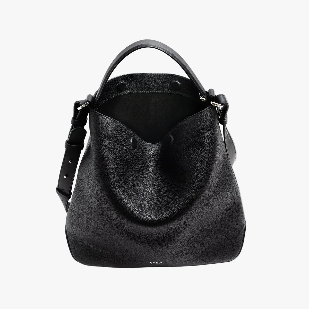 STOW London's Curve bag in Black pebbled leather with magnets open the black suede interior lining featuring silver stainless steel hardware on a light grey background