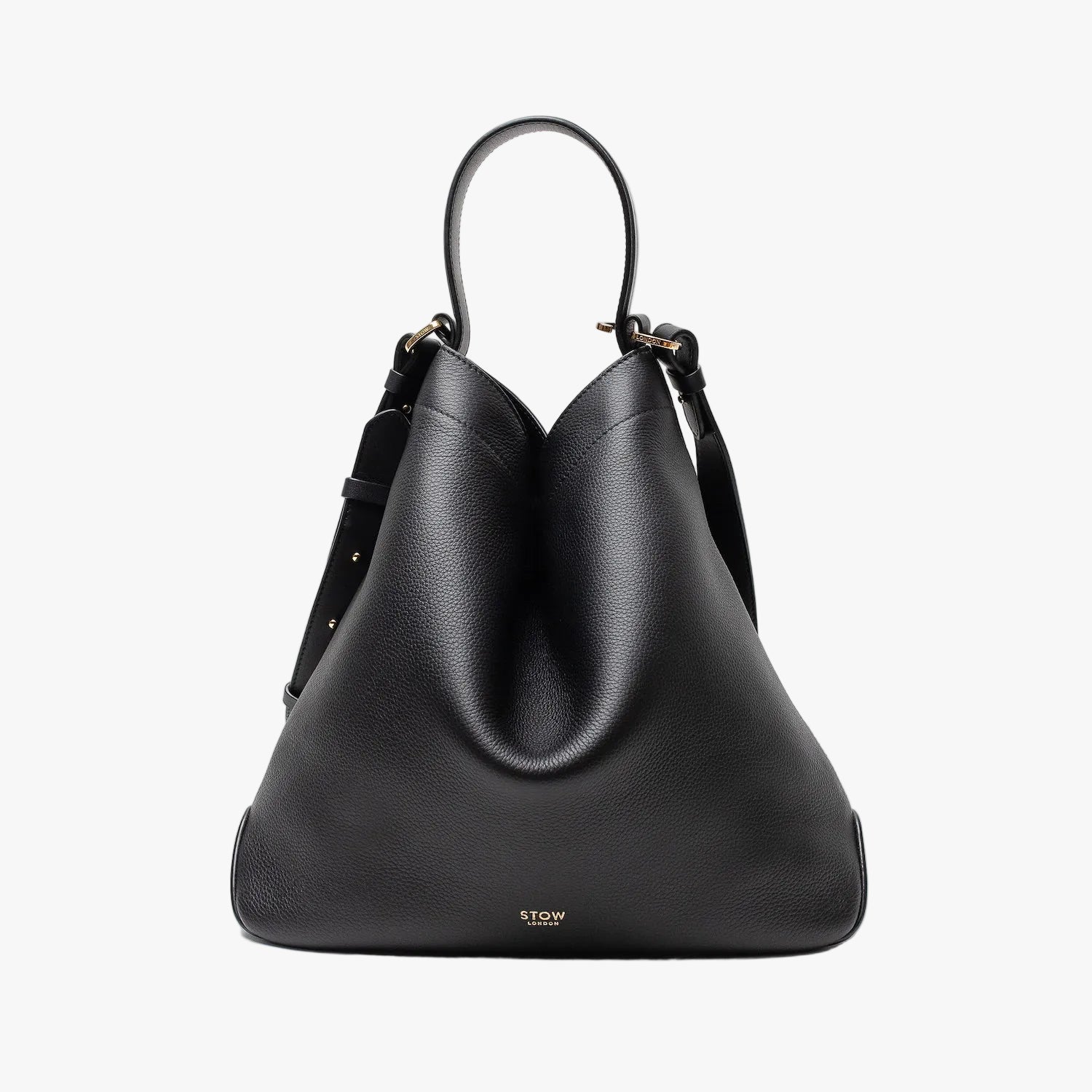 Stow London's Curve bag in Black pebbled leather shaped in a triangular form featuring gold-coated stainless steel hardware on a light grey background