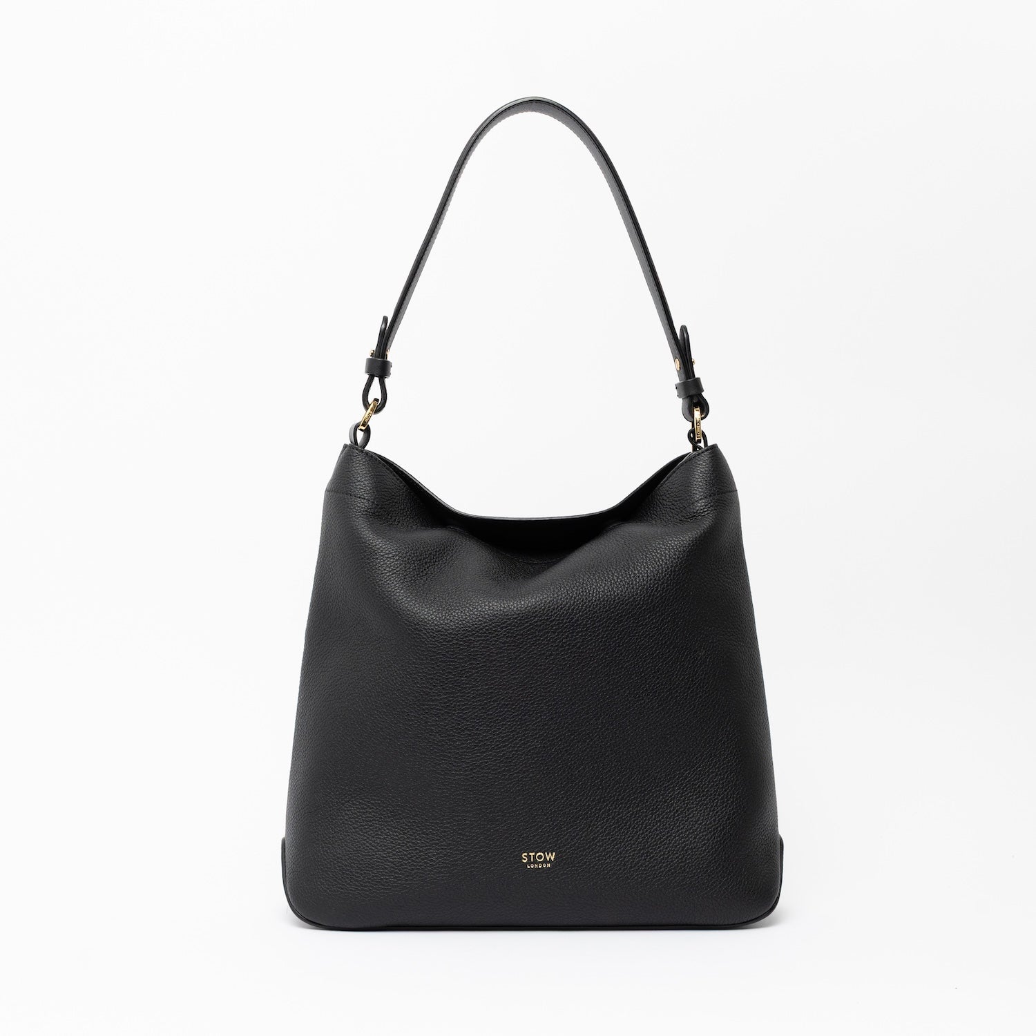 STOW London's Curve in Black leather on a light grey background featuring the detachable shoulder strap with gold hardware and details