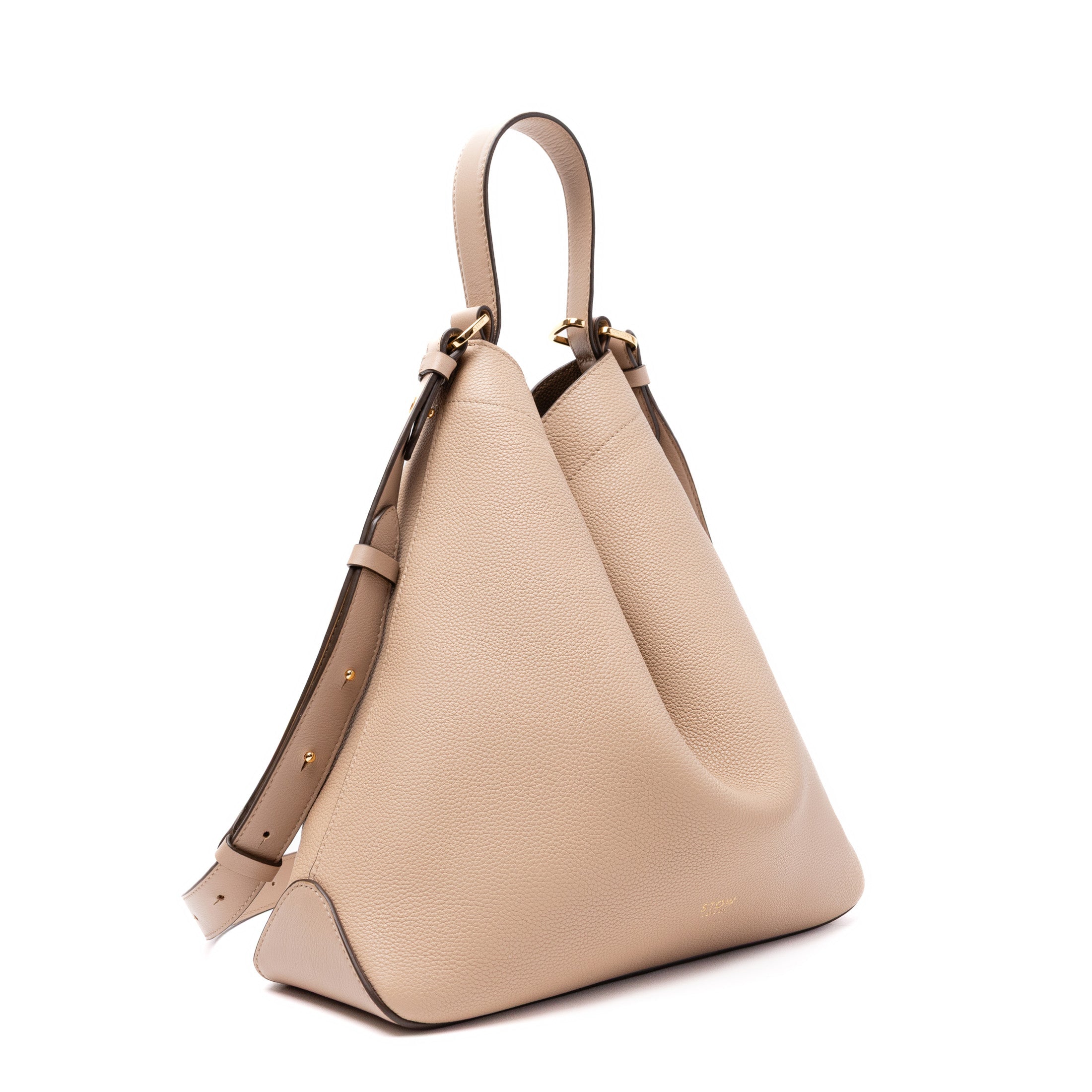 Off-axis view of STOW London's Curve bag in Camel pebbled and smooth leather featuring gold-coated stainless steel hardware on a white background