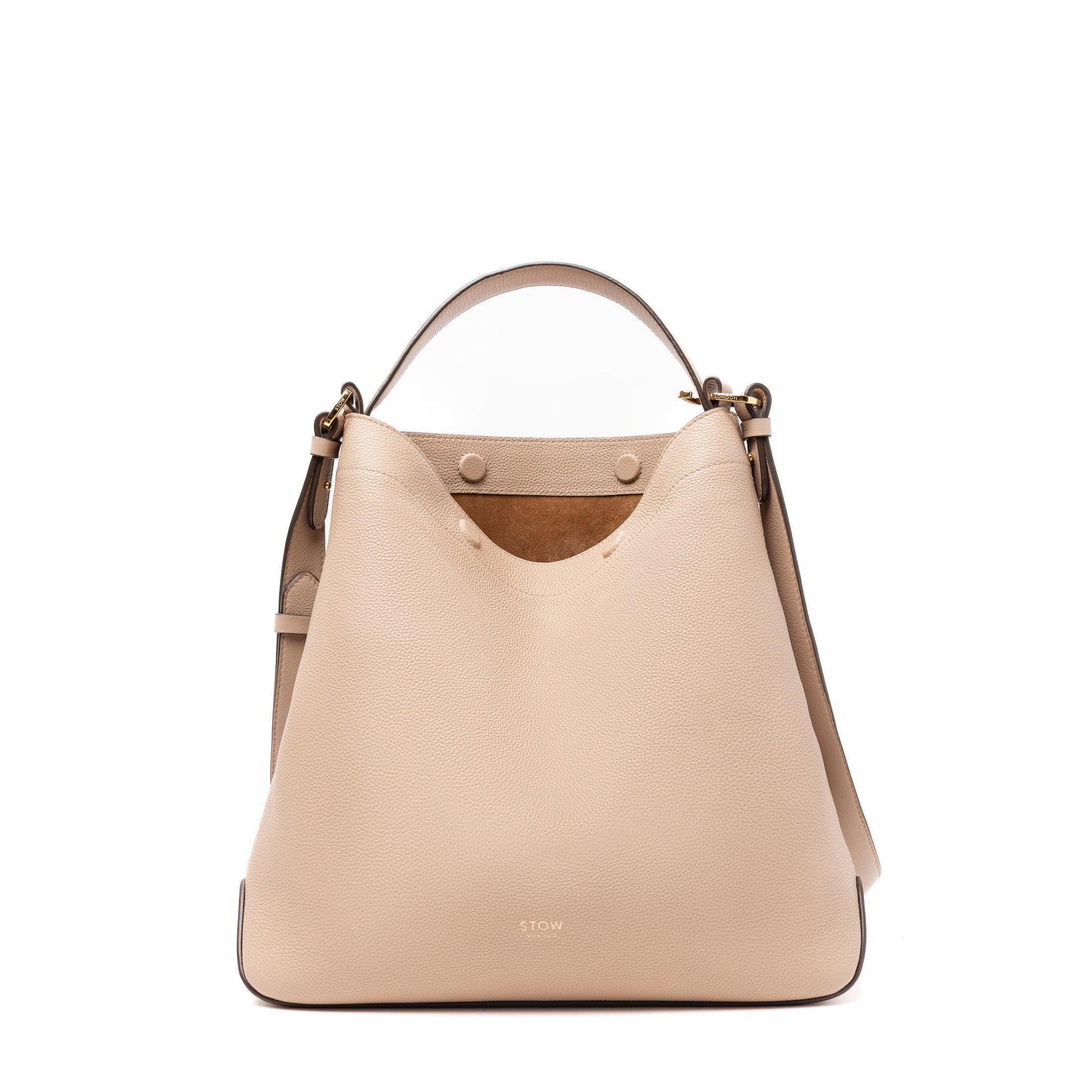 STOW London's Curve bag in Camel pebbled and smooth leather featuring gold-coated stainless steel hardware on a white background