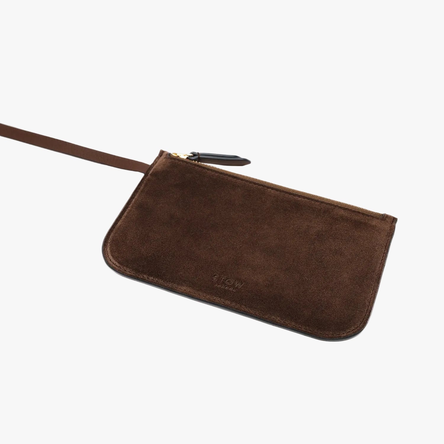 The matching, detachable interior zip pouch from STOW London's Curve bag in Chocolate suede leather featuring gold-coated stainless steel hardware on a light grey background