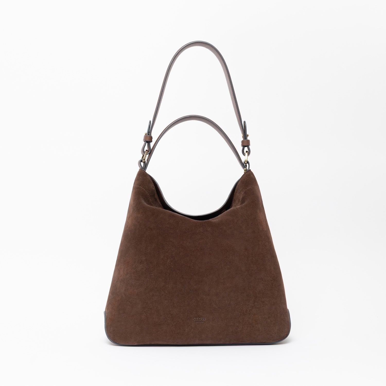 STOW London's Curve in Black leather on a light grey background featuring the detachable shoulder strap and top handle with gold hardware and details
