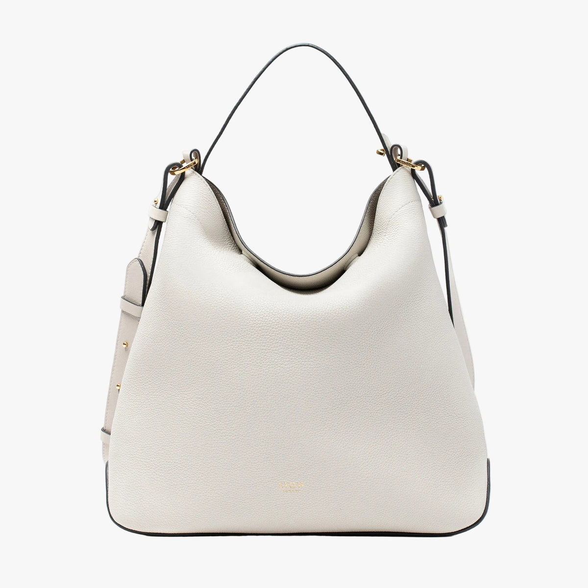 Stow London's Curve bag in Cloud Grey pebbled leather featuring gold-coated stainless steel hardware on a light grey background