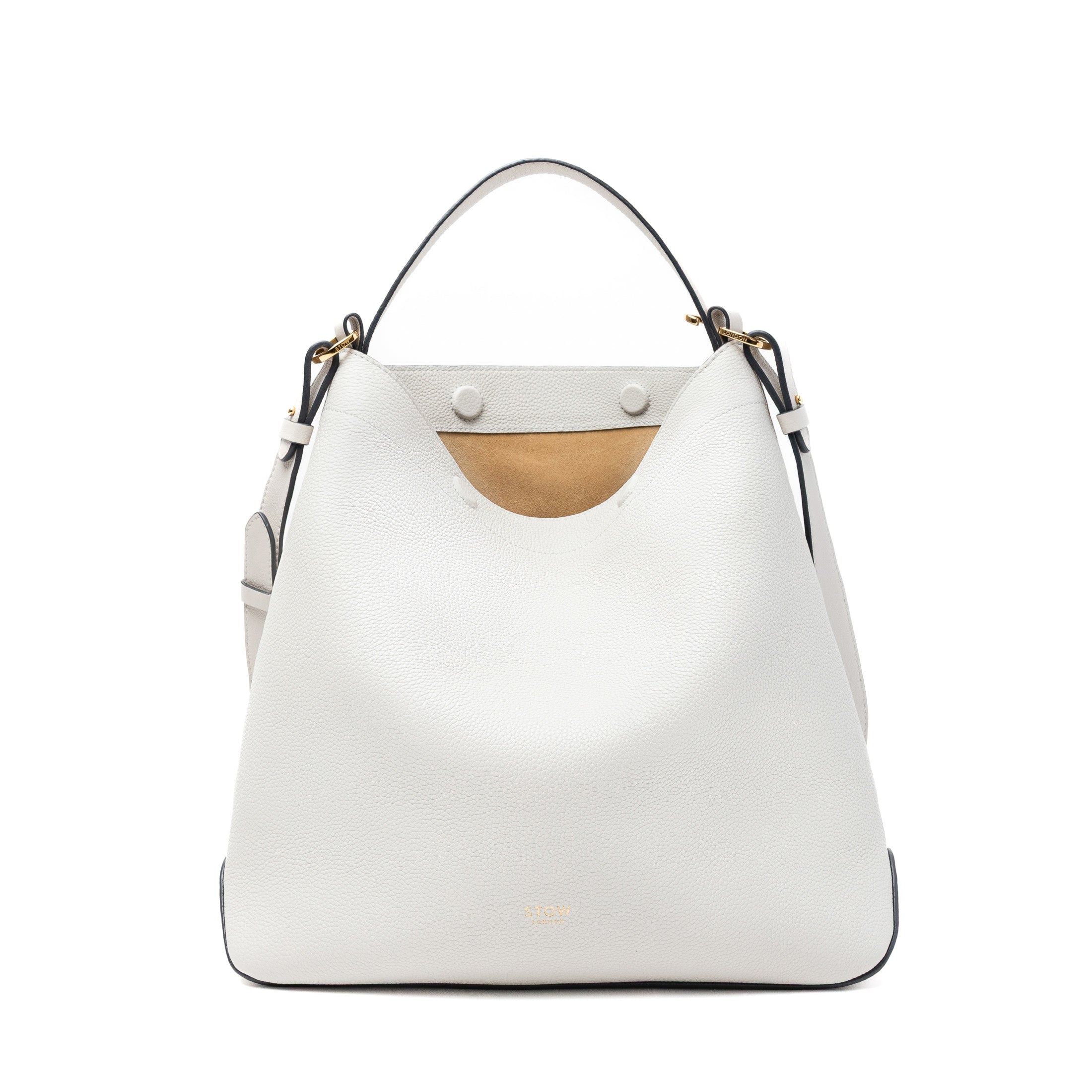 Stow London's Curve bag in Cloud Grey pebbled leather with magnets open showing cognac suede interior featuring gold-coated stainless steel hardware on a light grey background