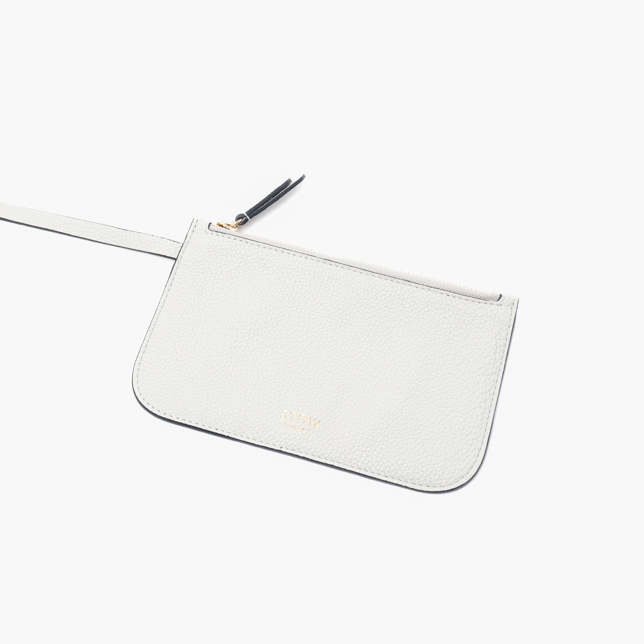 Close up of the detachable interior pouch of Stow London's Curve bag in Cloud Grey pebbled leather on a light grey background