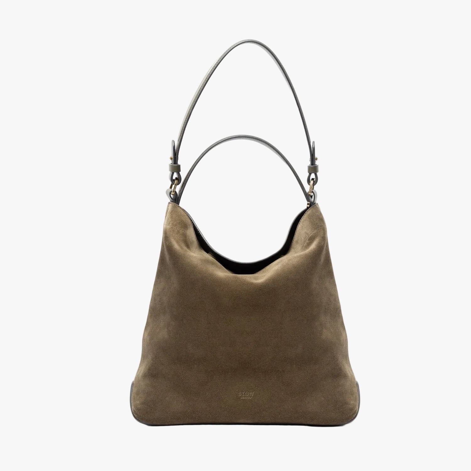 STOW London's Curve in Dark Green suede leather on a light grey background featuring the detachable shoulder strap and top handle with gold hardware