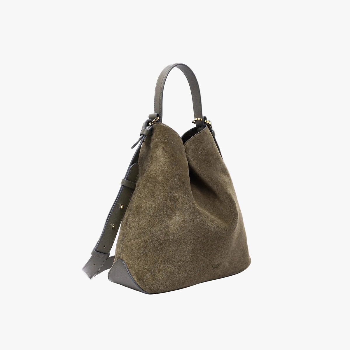 Off-axis view of Stow London's Curve bag in Dark Green suede leather shaped in a triangular form featuring gold-coated stainless steel hardware on a light grey background