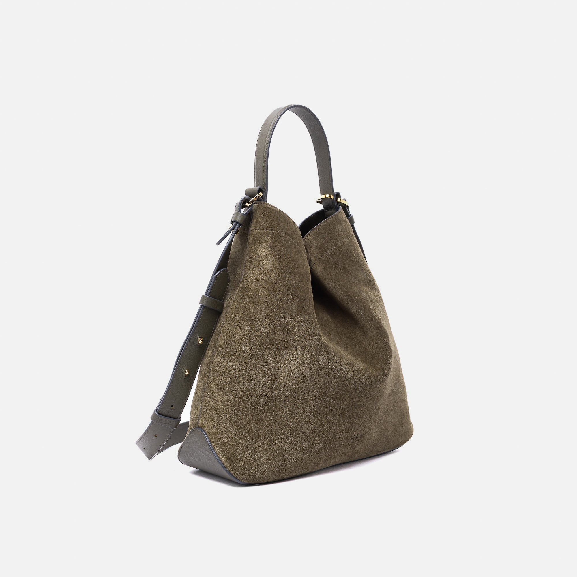 Off-axis view of Stow London's Curve bag in Dark Green suede leather shaped in a triangular form featuring gold-coated stainless steel hardware on a light grey background