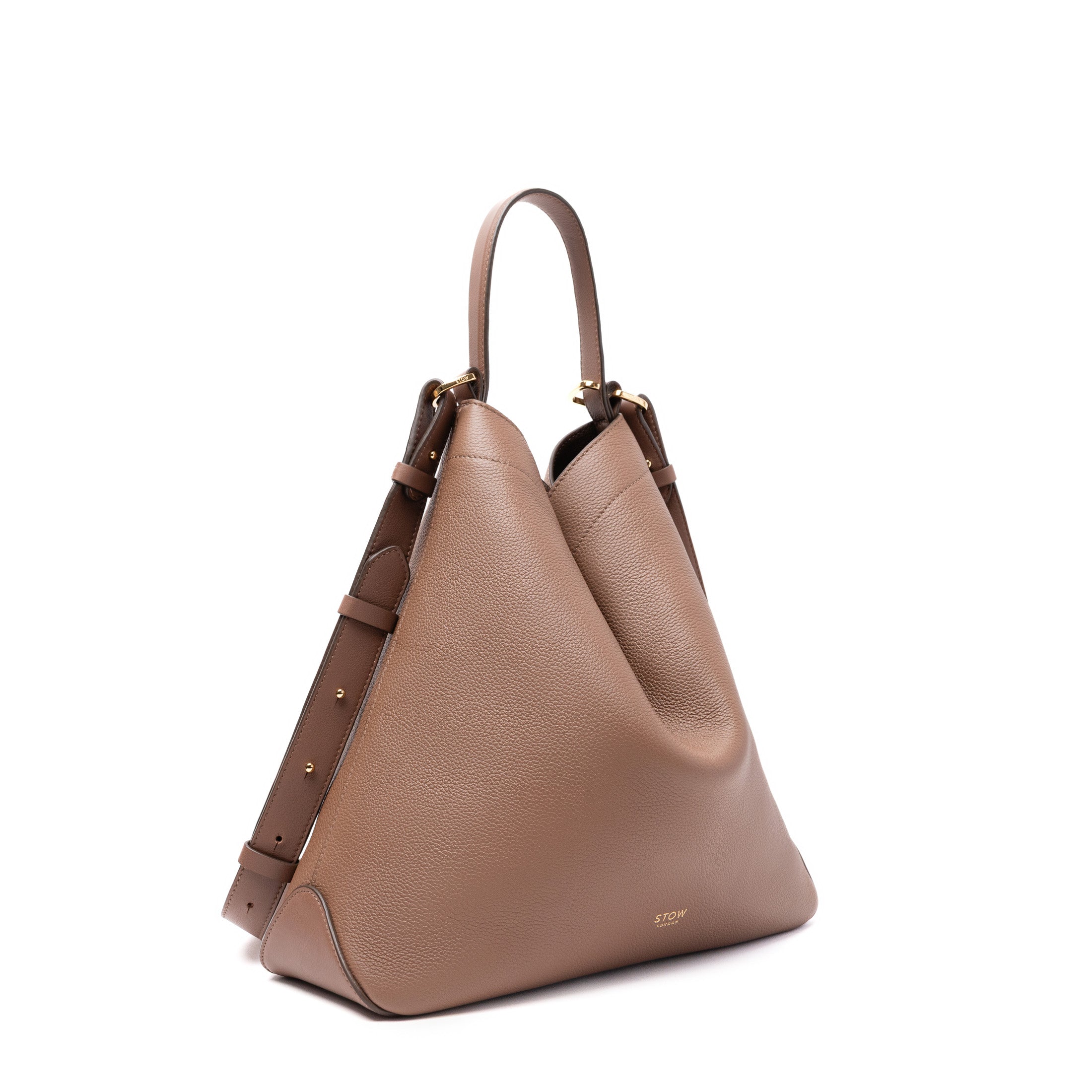 Off-axis view of STOW London's Curve in Mocha pebbled and smooth leather featuring gold-coated stainless steel hardware on a white background