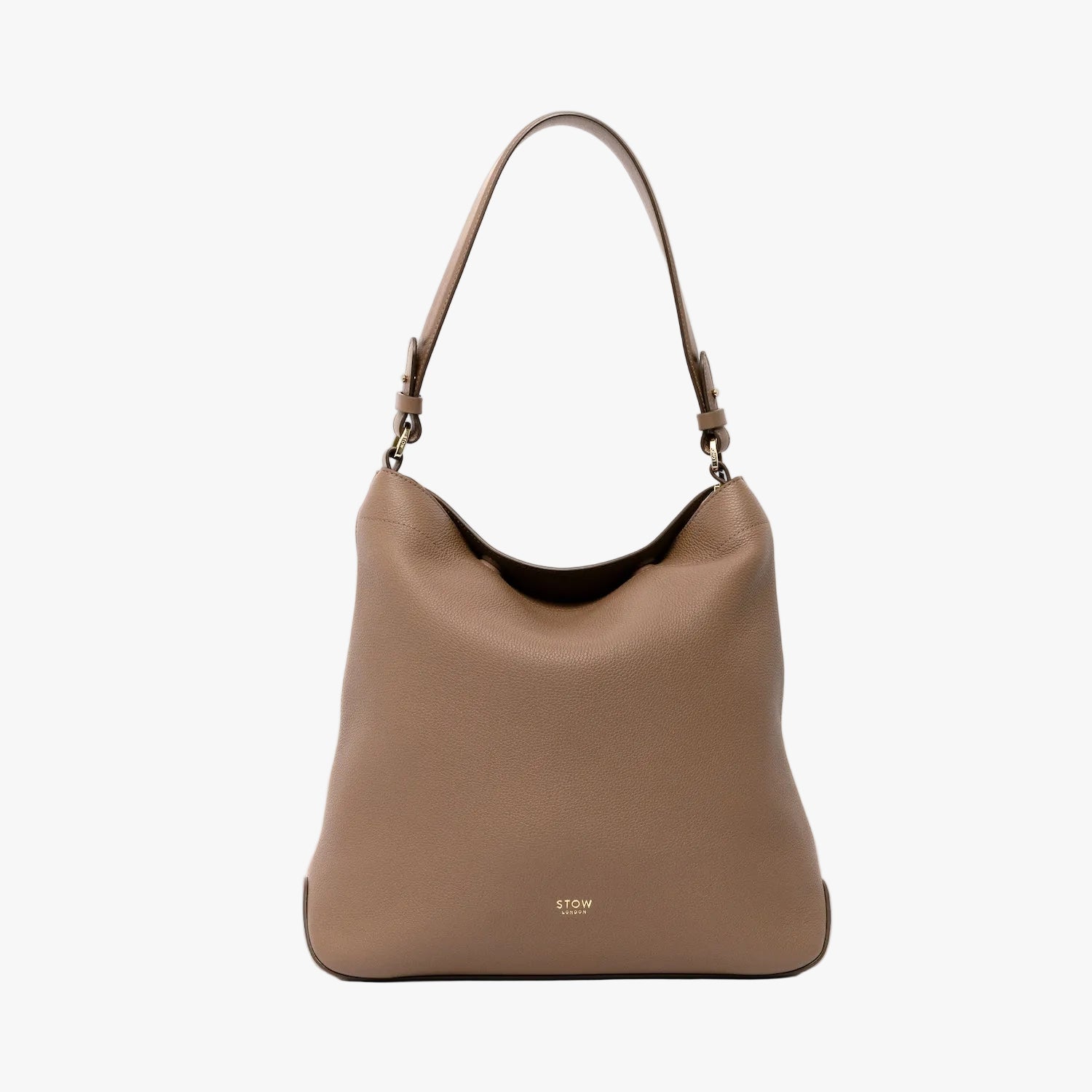 STOW London's Curve in Mocha leather on a light grey background featuring the detachable shoulder strap with gold hardware and details
