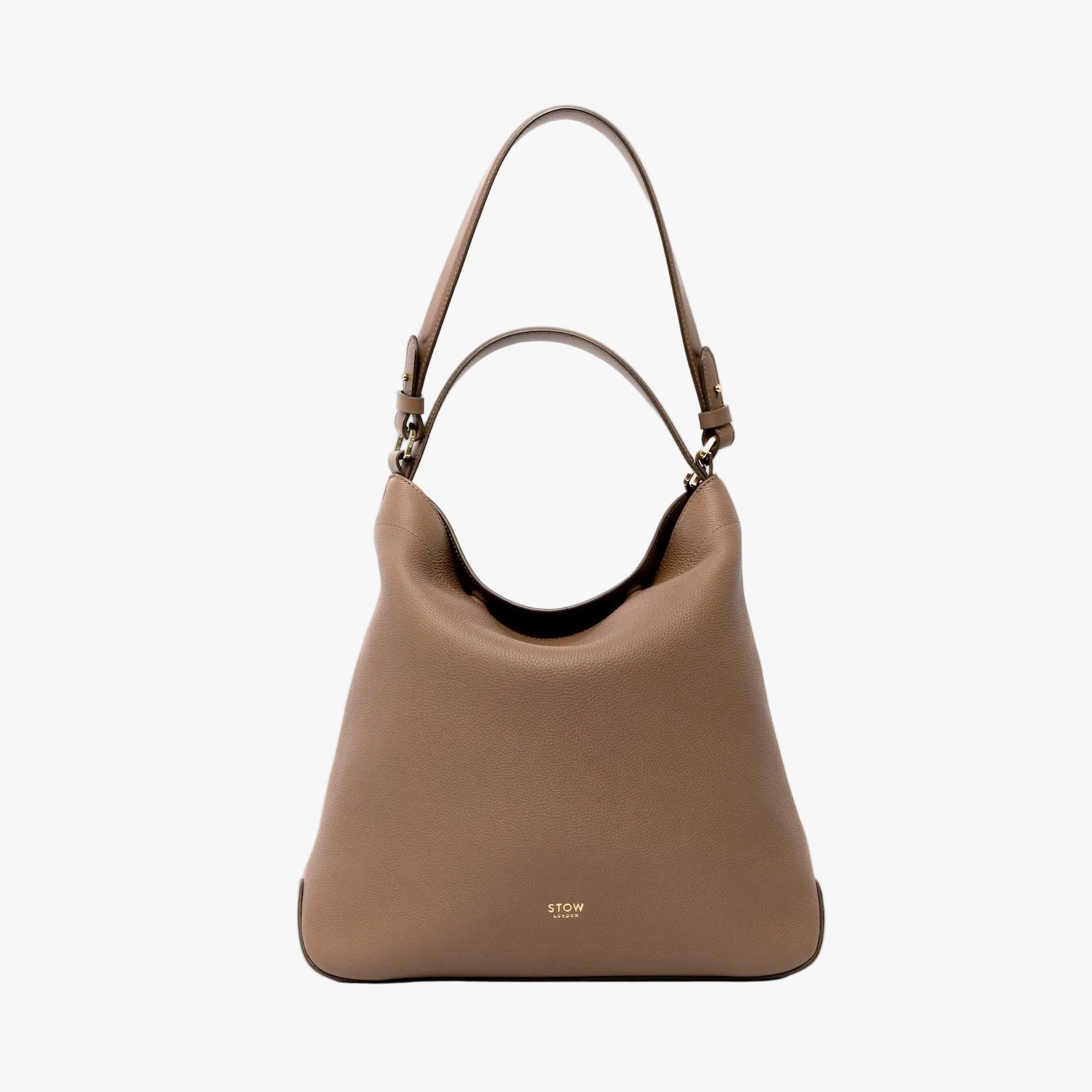 STOW London's Curve in Mocha leather on a light grey background featuring the detachable shoulder strap and top handle with gold hardware and details