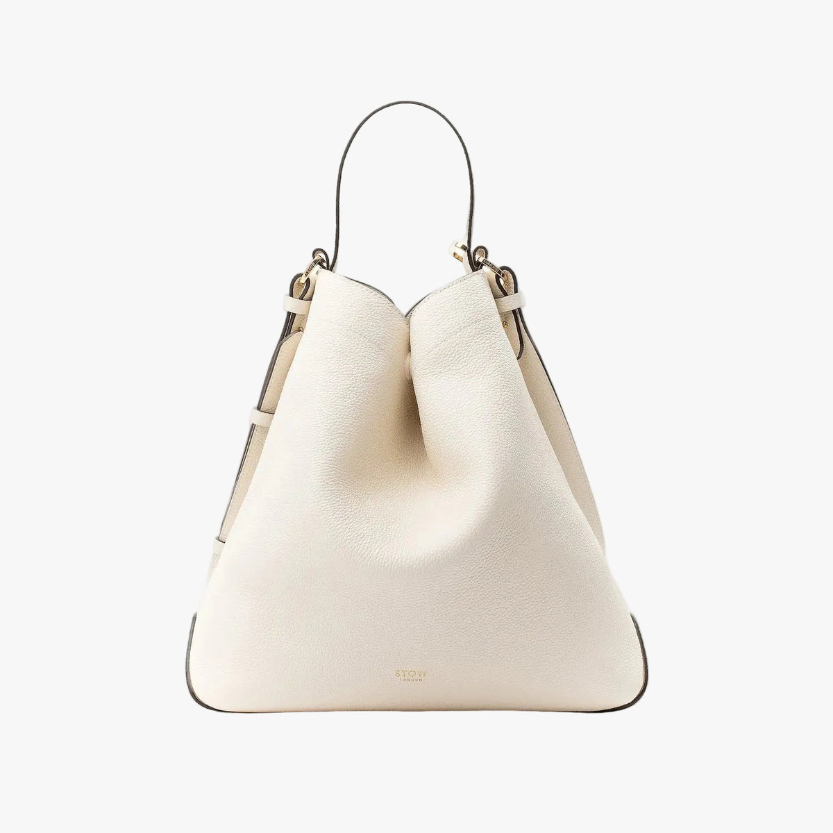 Stow London's Curve bag in Spring Moon pebbled leather in a triangular shape featuring gold-coated stainless steel hardware on a light grey background