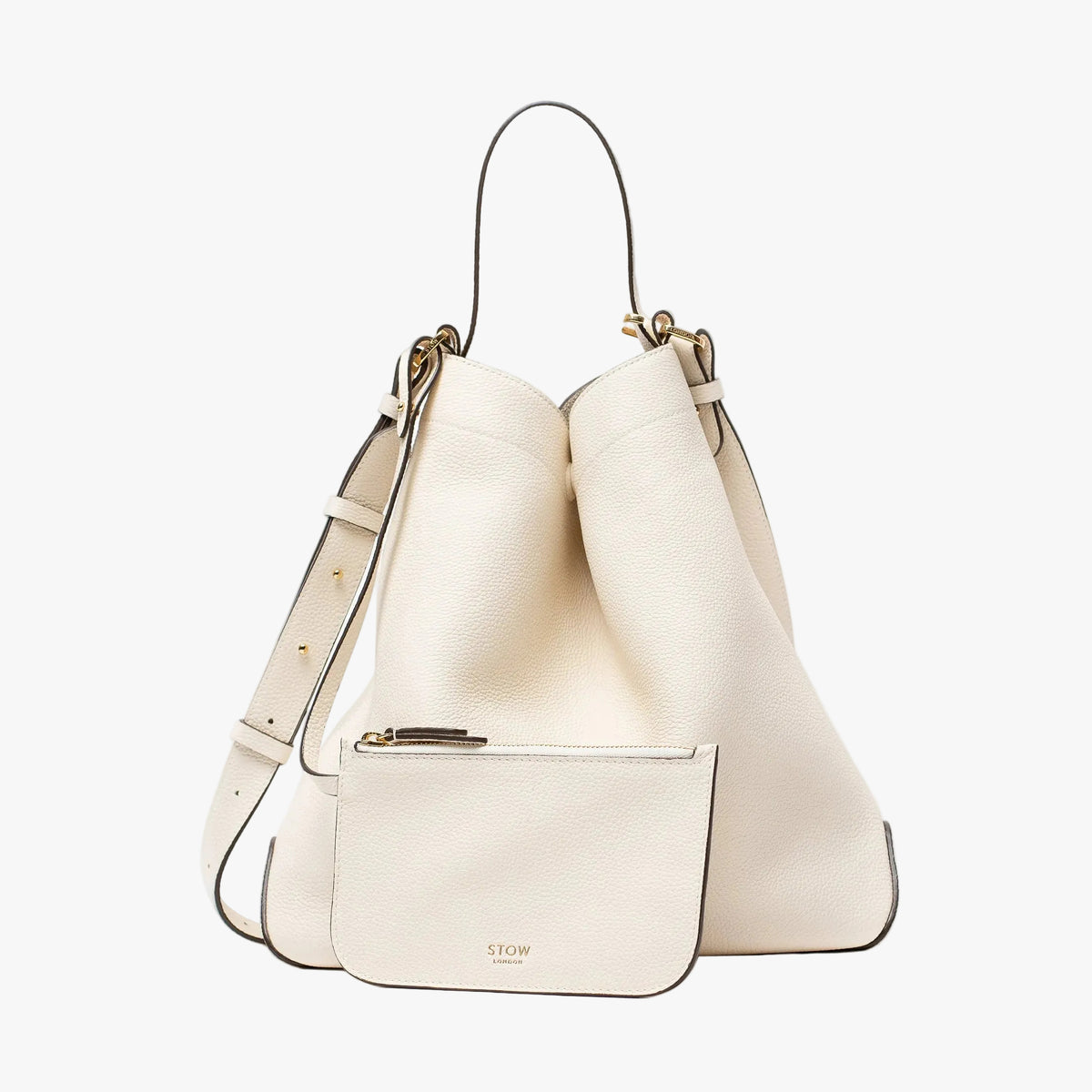 Stow London's Curve bag and matching, detachable interior pouch in Spring Moon pebbled leather featuring gold-coated stainless steel hardware on a light grey background