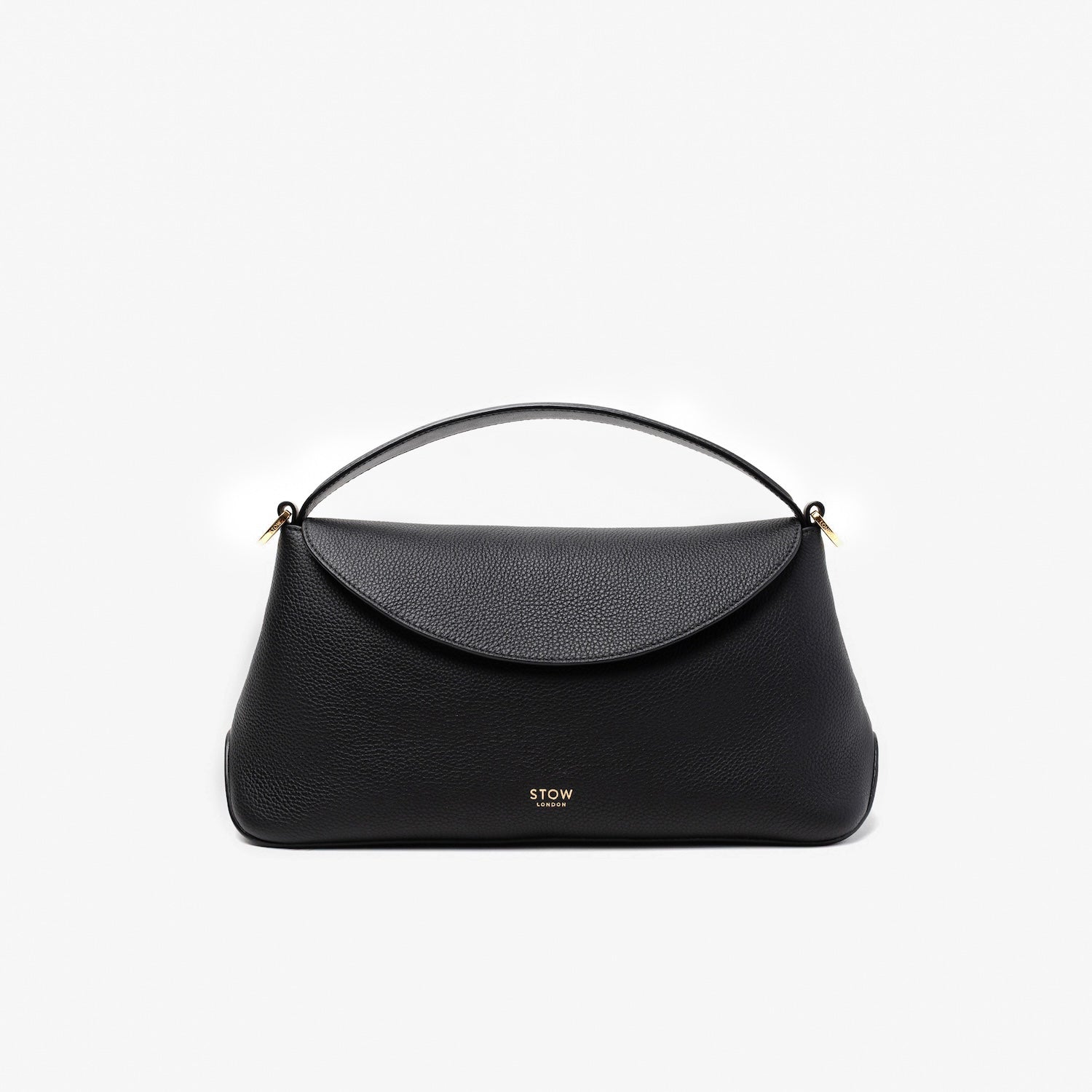 STOW London's East West in Black pebbled leather featuring gold-coated stainless steel hardware on a light grey background