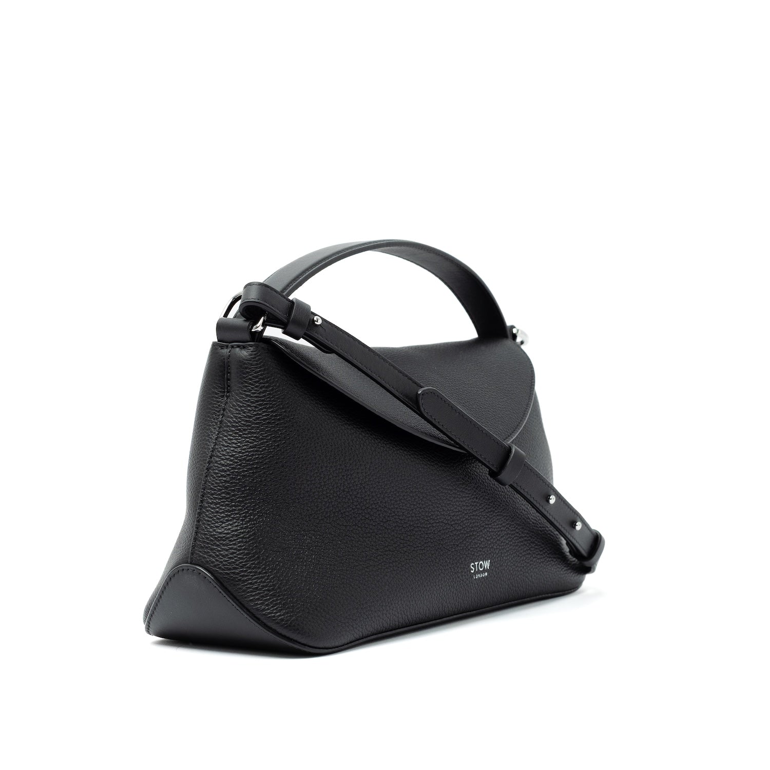 Side view of STOW London's East West bag and detachable, adjustable strap in Black pebbled and smooth leather featuring silver stainless steel hardware on a white background