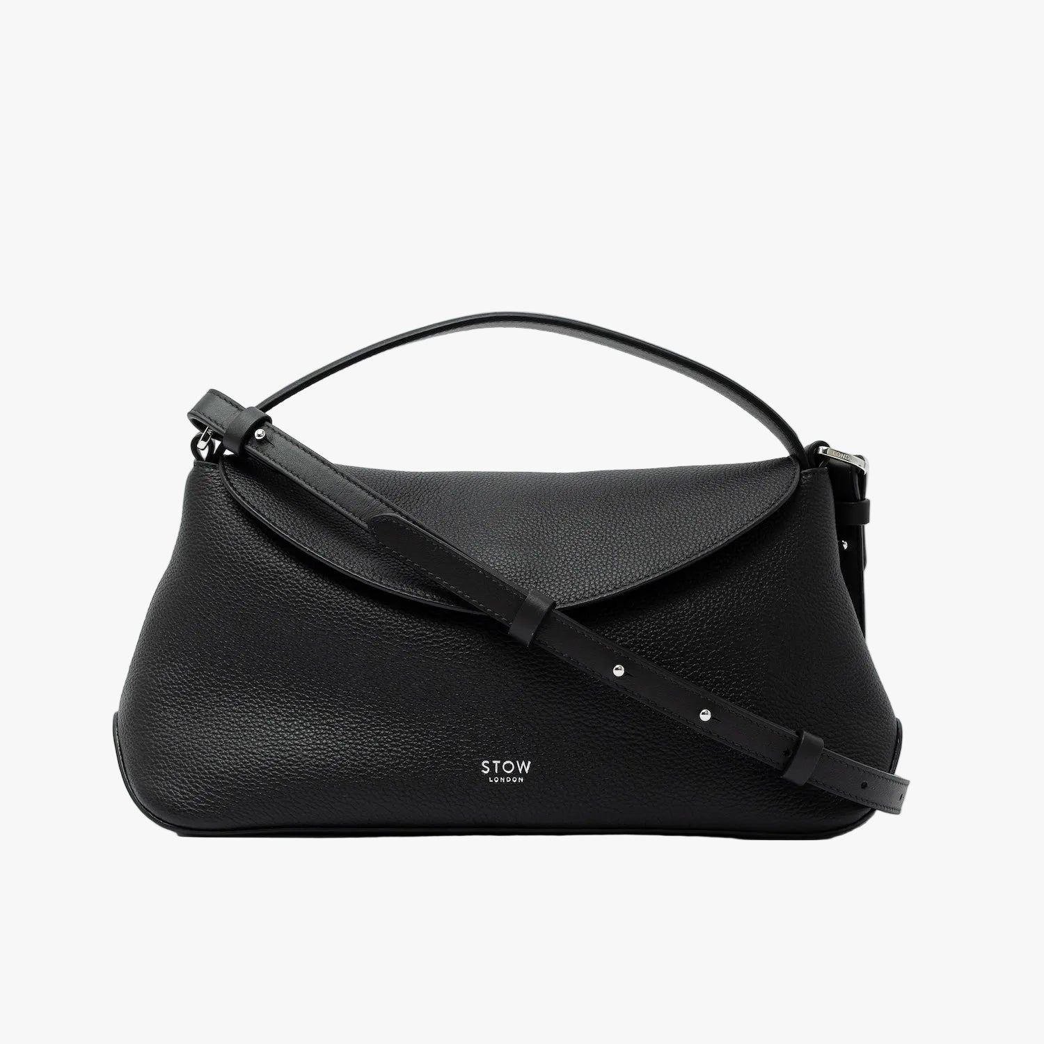 STOW London's East West in Black pebbled leather and detachable crossbody strap featuring silver stainless steel hardware on a light grey background