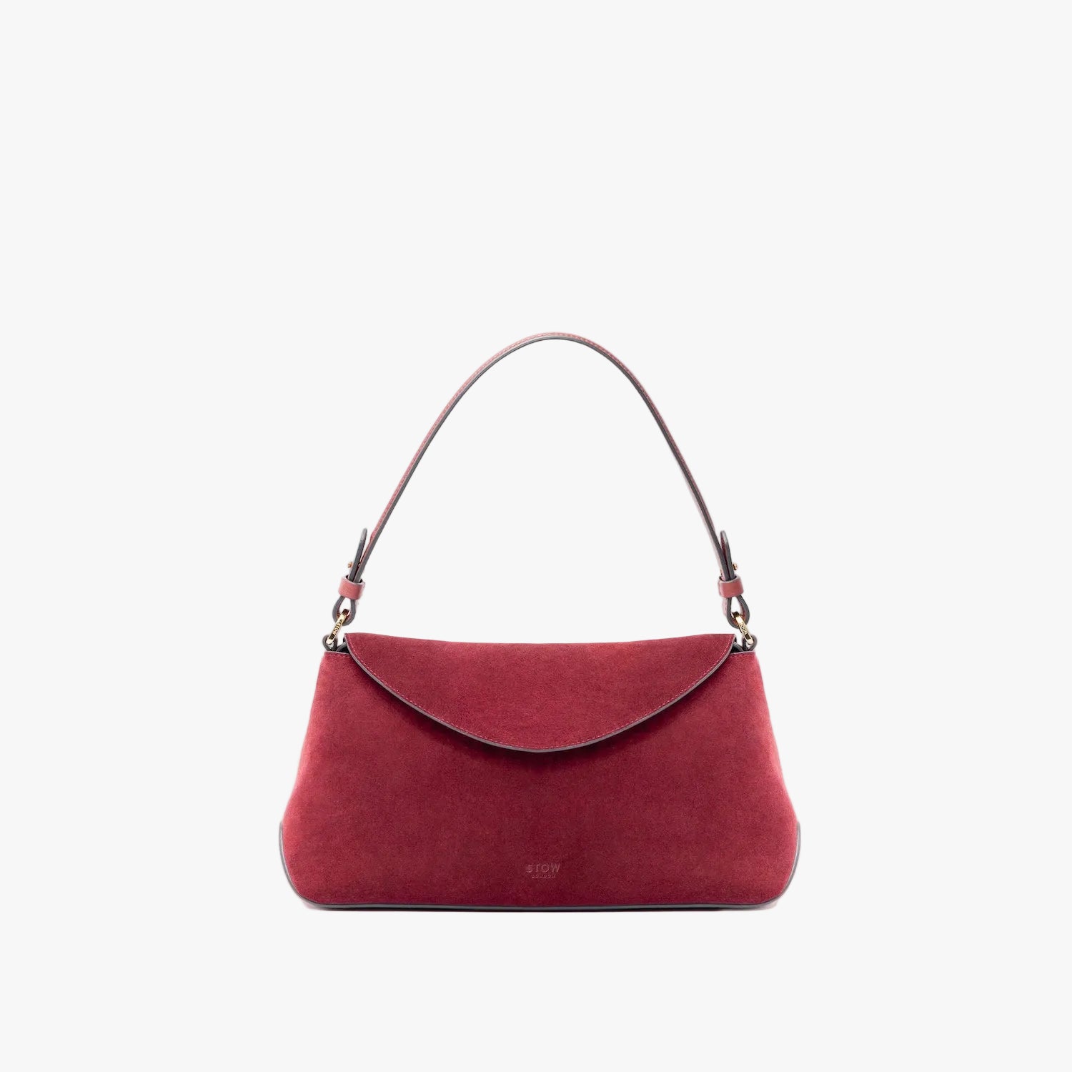STOW London's East West in Burgundy suede leather on a light grey background featuring the detachable shoulder strap with gold hardware and details