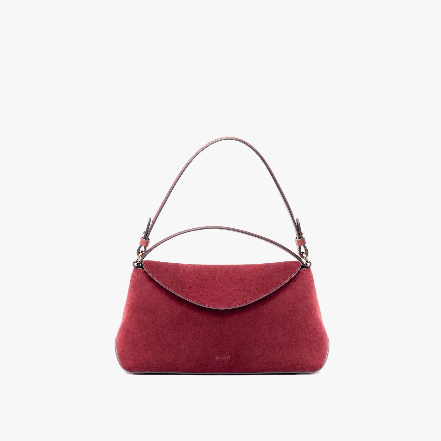 STOW London's East West in Burgundy suede leather on a light grey background featuring the detachable shoulder strap and top handle with gold hardware and details