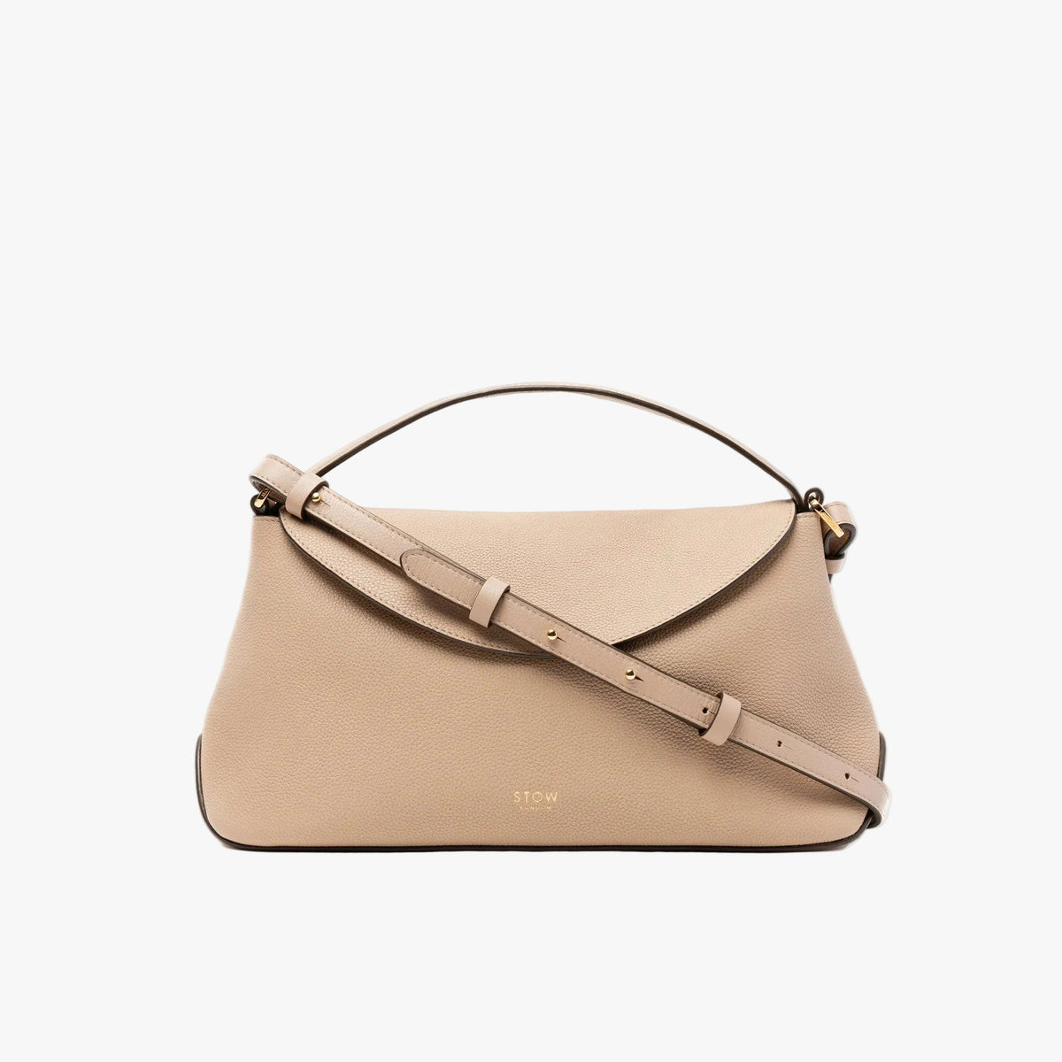 STOW London's East West in Camel pebbled leather featuring the crossbody leather strap and gold-coated stainless steel hardware on a light grey background