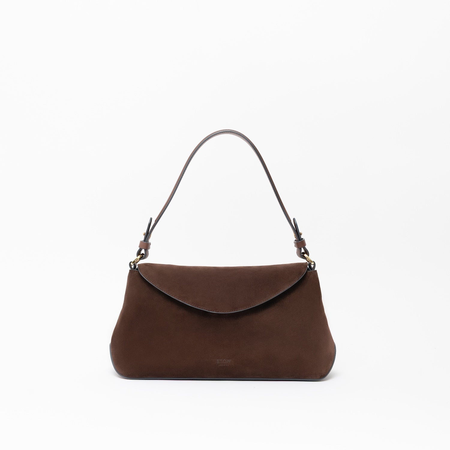 STOW London's East West in Chocolate suede leather on a light grey background featuring the detachable shoulder strap with gold hardware