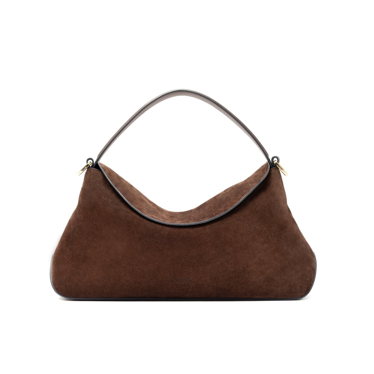 STOW London's East West bag in Chocolate Suede leather styled in its curved shape featuring gold-coated stainless steel hardware on a white background