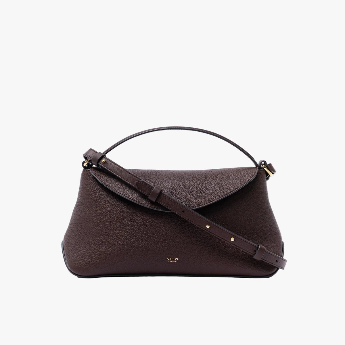 STOW London's East West in Espresso pebbled leather featuring the detachable crossbody strap and gold-coated stainless steel hardware on a light grey background