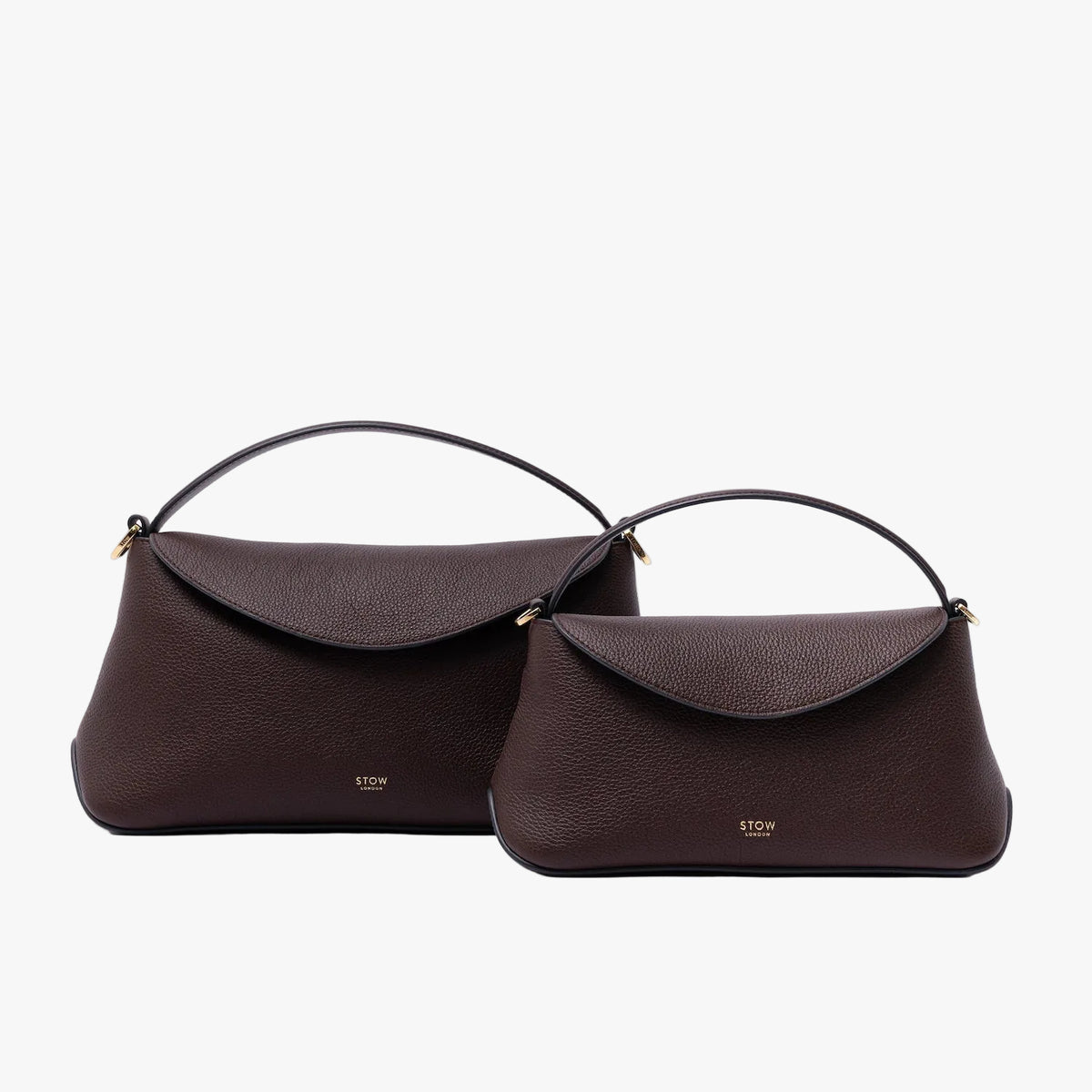 Size comparison of STOW London's Mini East West and East West in Espresso pebbled leather on a light grey background featuring gold-coated stainless steel hardware