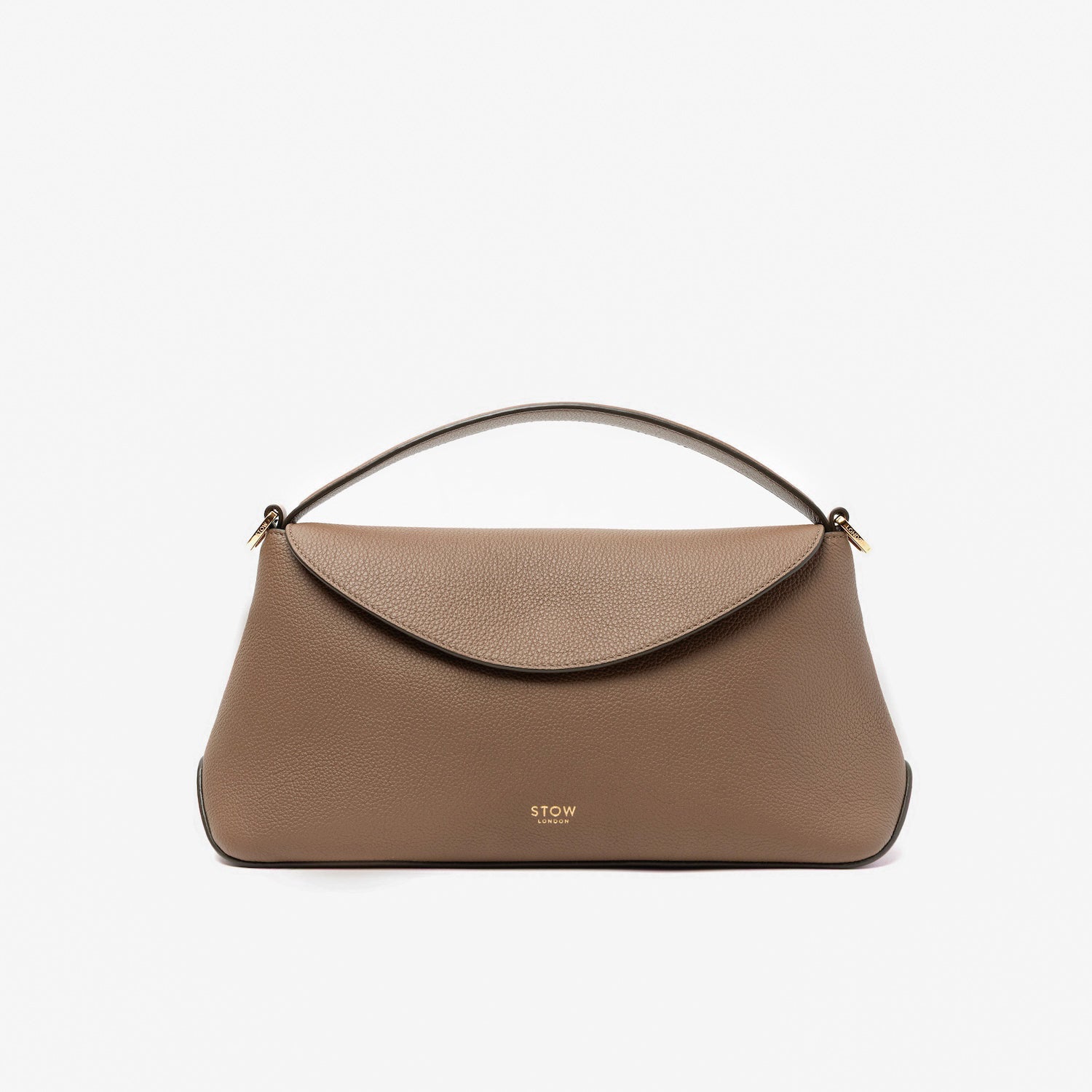 STOW London's East West in Mocha pebbled leather featuring gold-coated stainless steel hardware on a light grey background