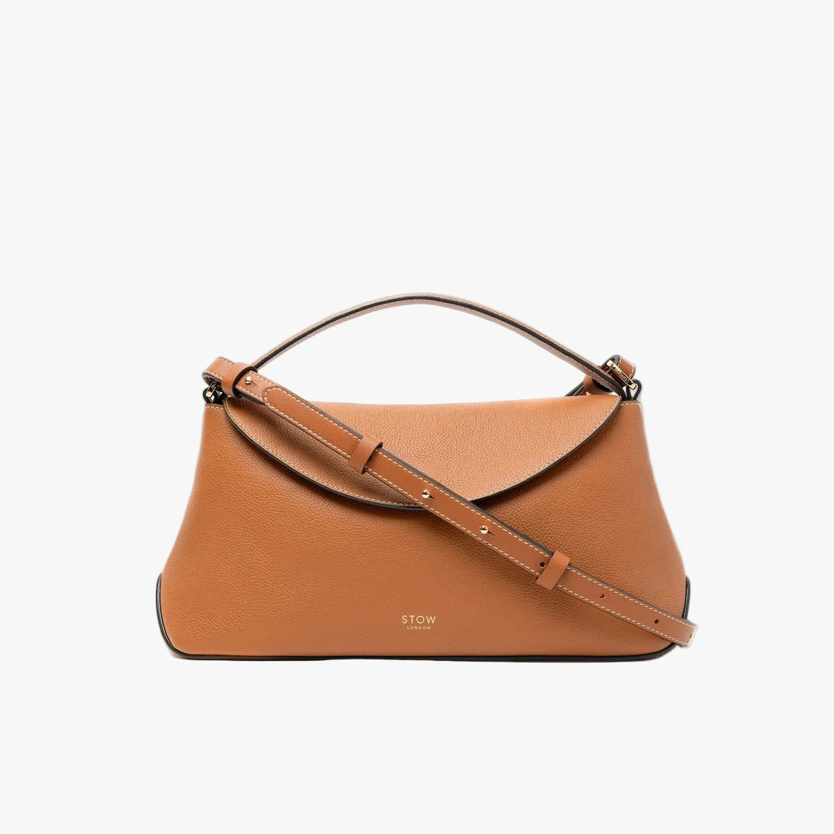 STOW London's East West bag in Earth Tan pebbled leather and crossbody strap featuring gold-coated stainless steel hardware on a light grey background